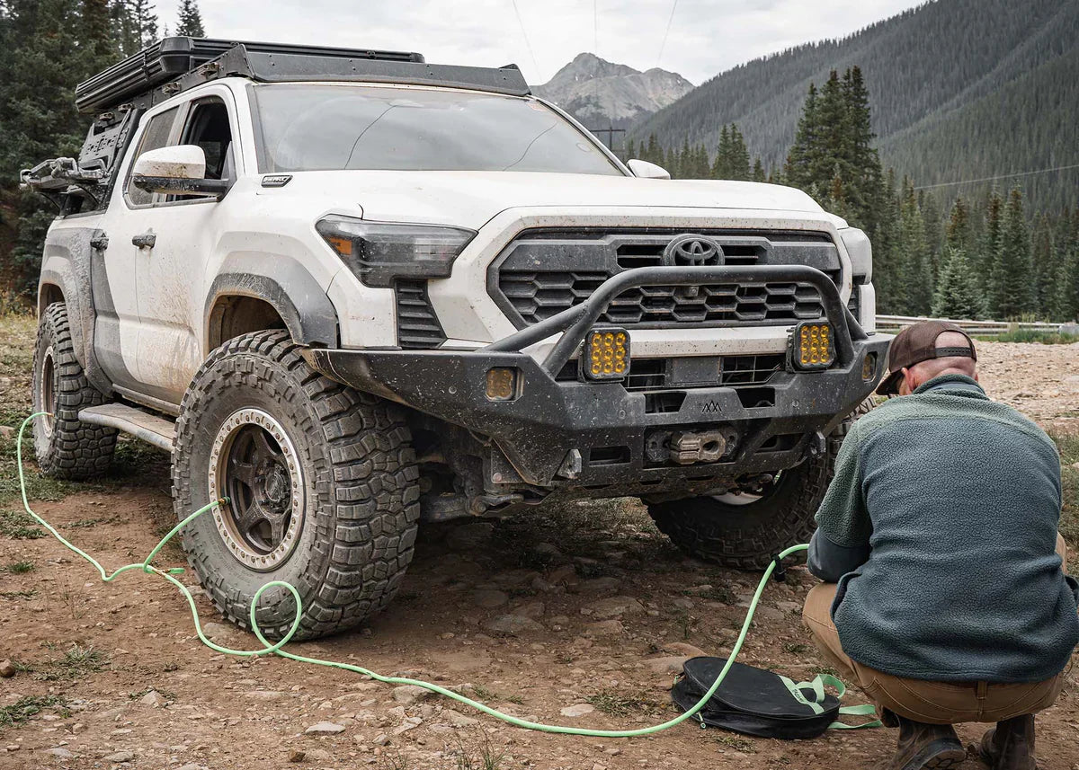 Backwoods Adventure Mods Hi-Lite Overland Front Bumper on a 2024 Toyota Tacoma being driven off road