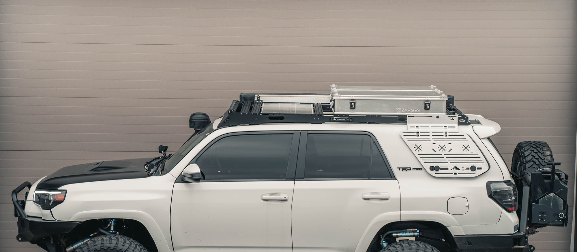 A toyota 4runner outfitted for camping, overlanding, fishing, mountain biking, and other adventure related activities displaying the utility of the roof rack.
