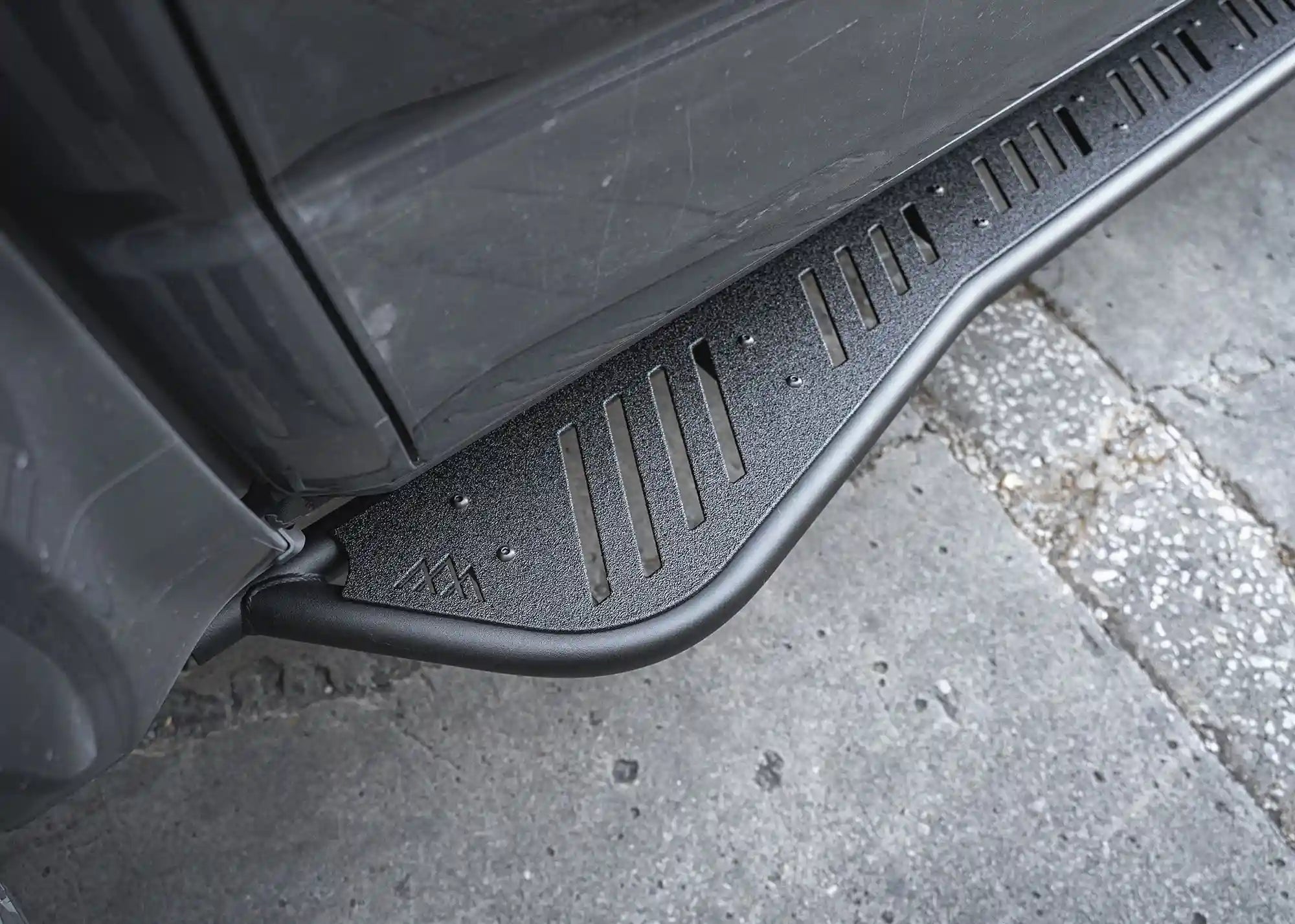 Close up of the kick out and side step on the 2024+ Toyota Tacoma Rock Sliders from Backwoods Adventure Mods