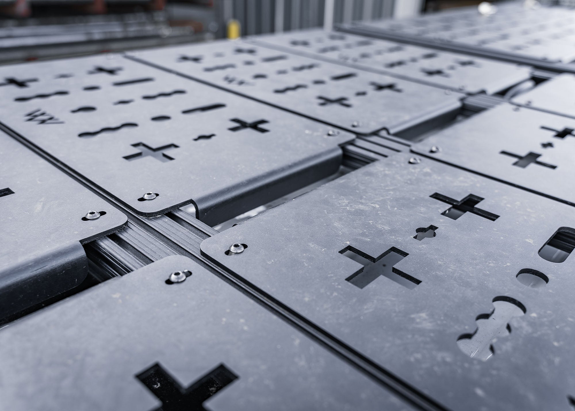 Close-up view of 2024 Tacoma Backwoods Adventure Mods DRIFTR roof rack modular cargo deck panel system