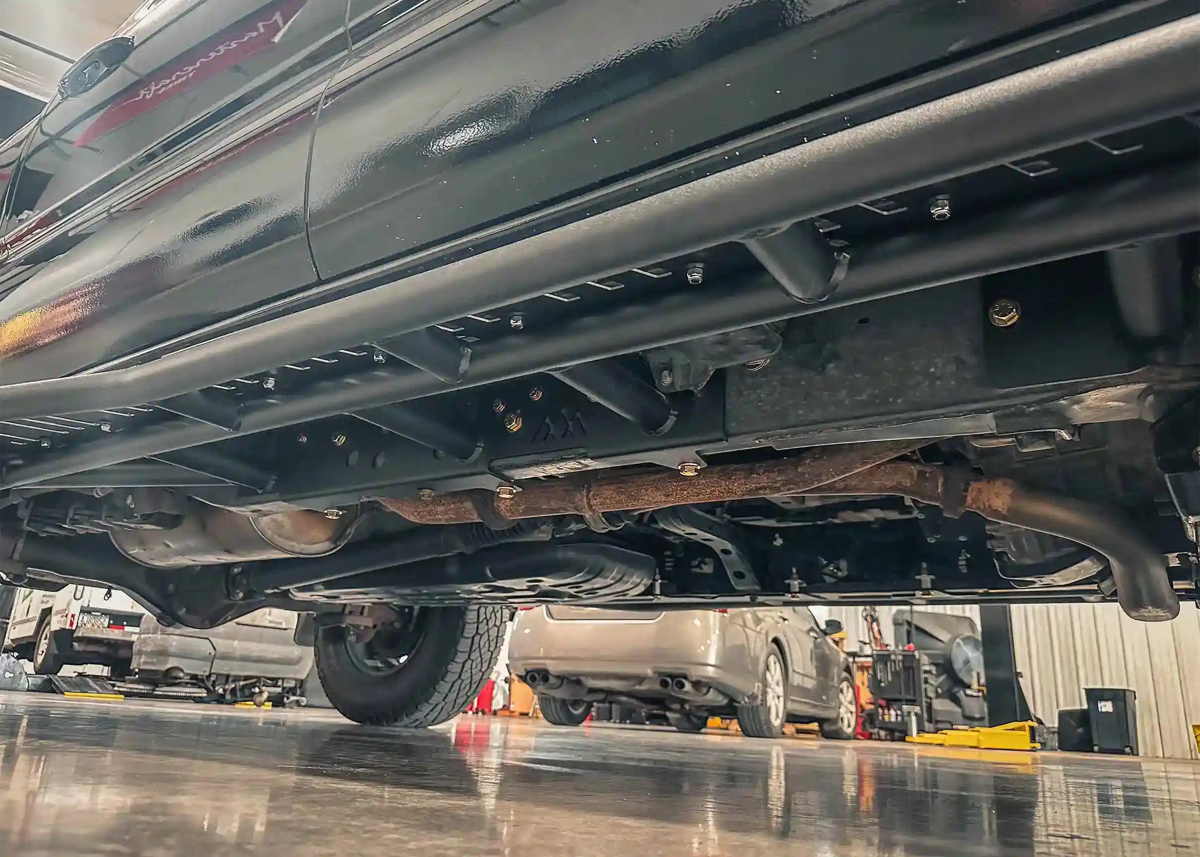 Close up of the bolt-on frame installation of the Backwoods Adventure Mods 2005-2023 2nd and 3rd Gen Toyota Tacoma Rock Sliders