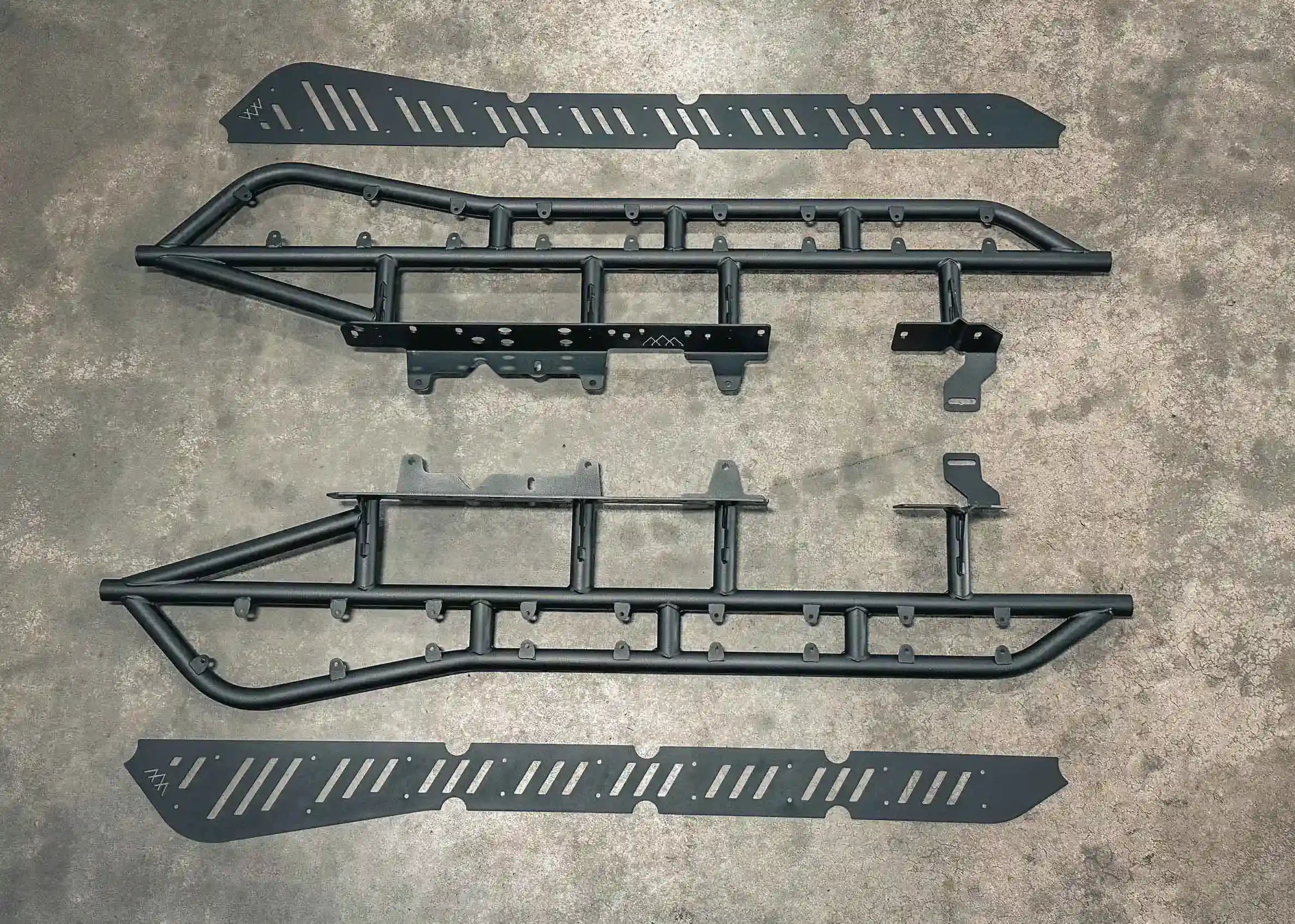 Installation components for the Backwoods Adventure Mods 2005-2023 2nd and 3rd Gen Toyota Tacoma Rock Sliders