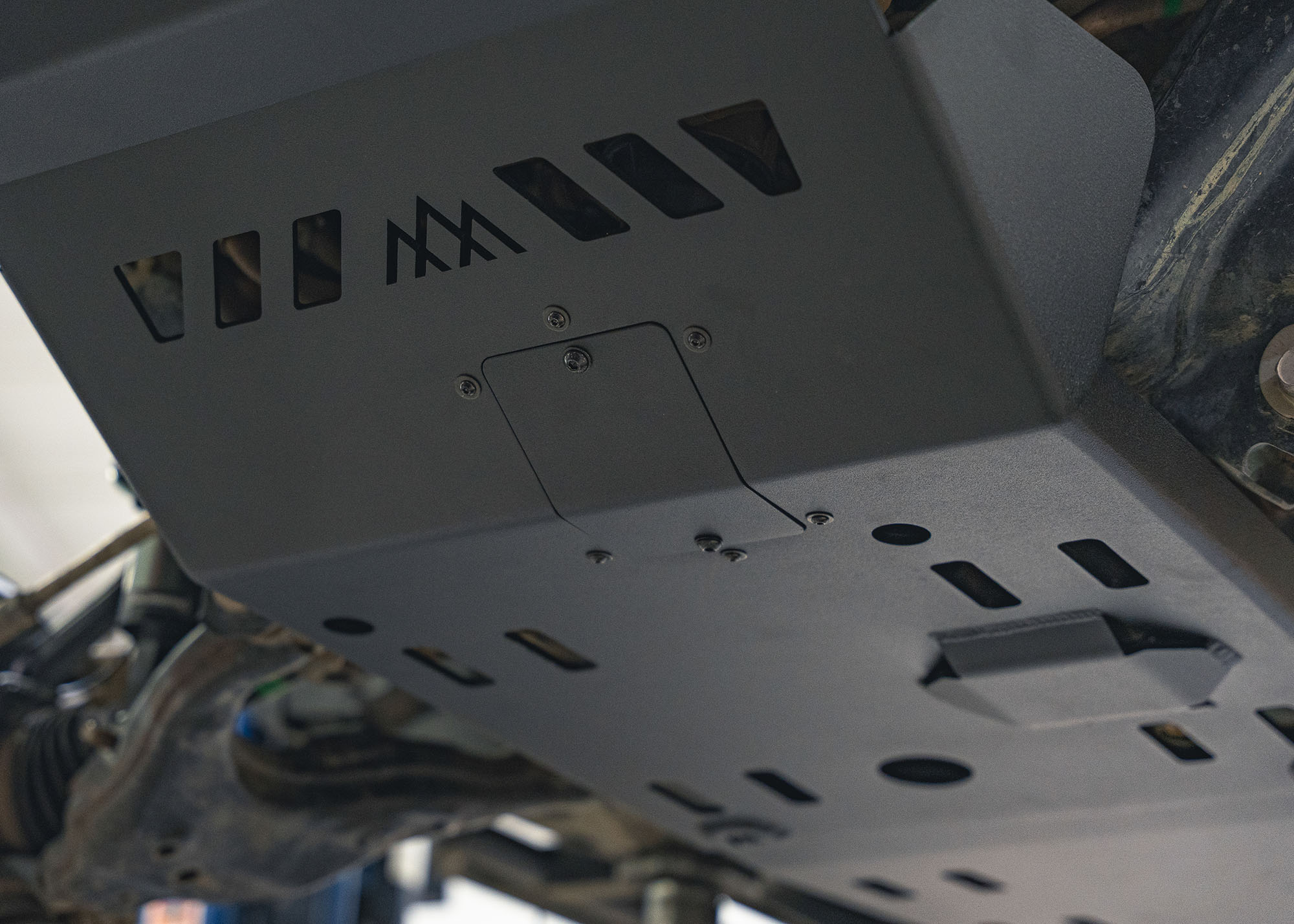 Close up of the service access panel on the Backwoods Adventure Mods Aluminum 2nd and 3rd Gen Toyota Tacoma Skid Plate Kit