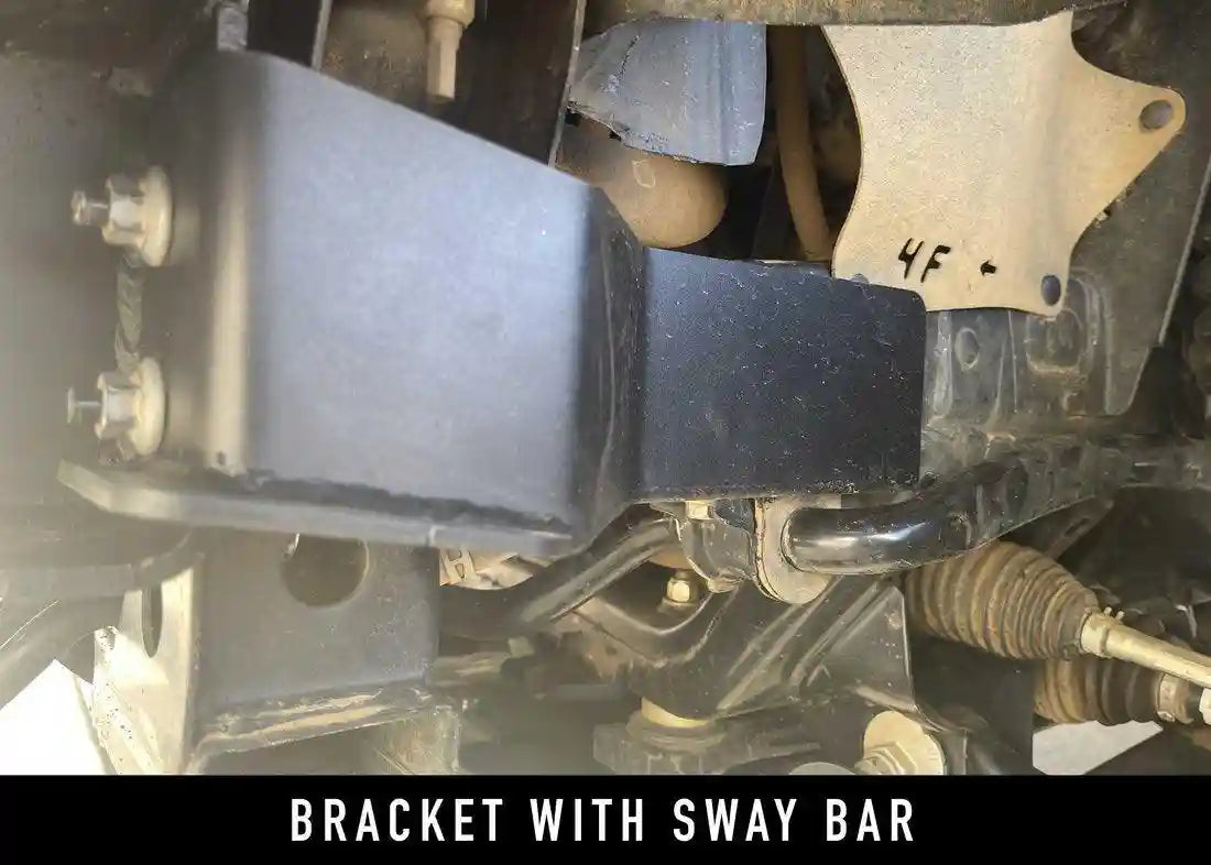 Close up of mounting bracket for 2016+ Toyota Tacoma Hi-Lite Overland Front Bumper with Bull Bar from Backwoods Adventure Mods mounted on a 3rd gen Tacoma with sway bar installed