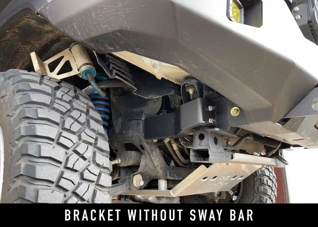 Close up of mounting bracket for 2016+ Toyota Tacoma Hi-Lite Overland Front Bumper with Bull Bar from Backwoods Adventure Mods mounted on a 3rd gen Tacoma without sway bar installed