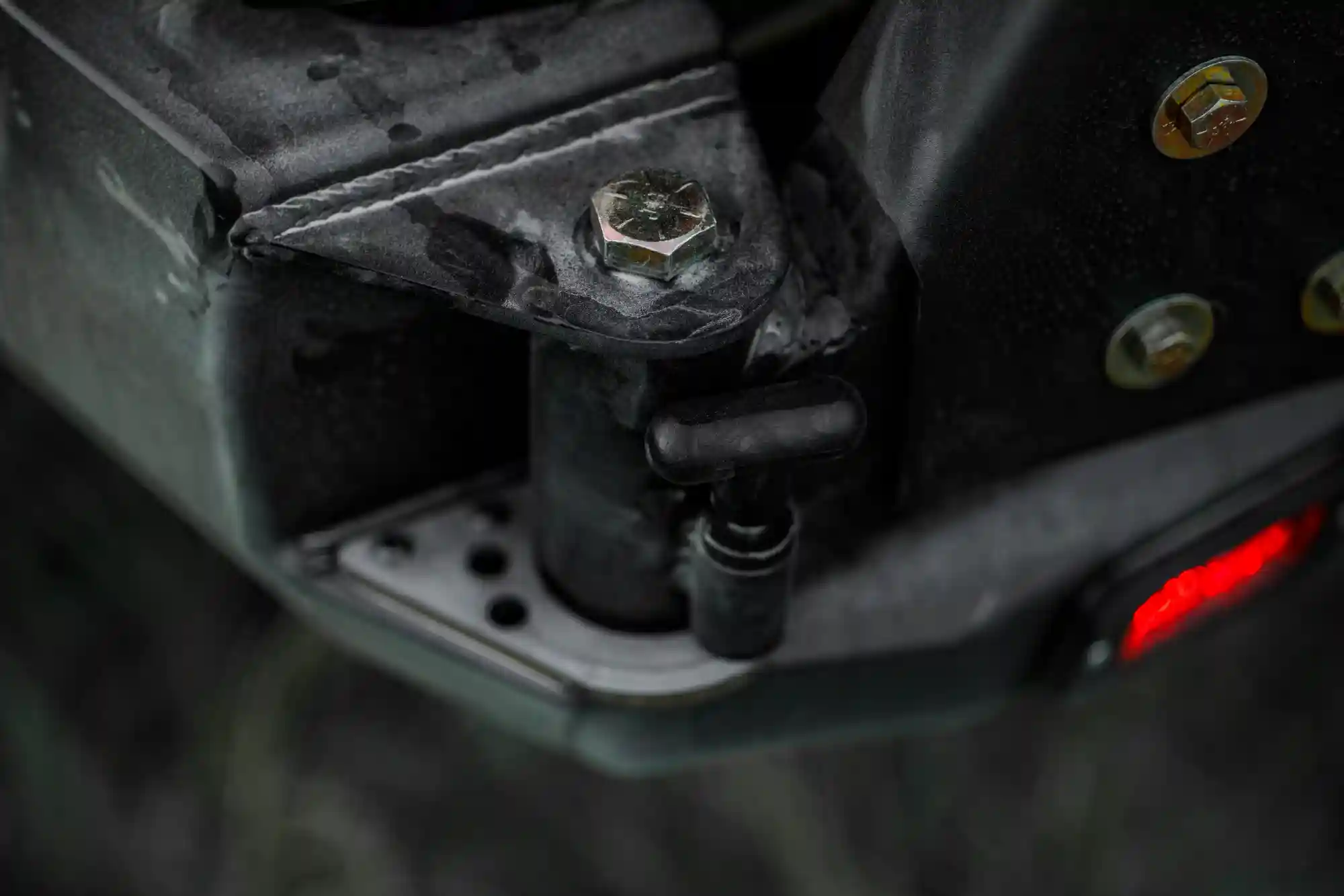 Close up of the swing out hinge on the Backwoods Adventure Mods 2016-2023 3rd Gen Toyota Tacoma Hi-Lite High Clearance Dual Swing Out Rear Bumper