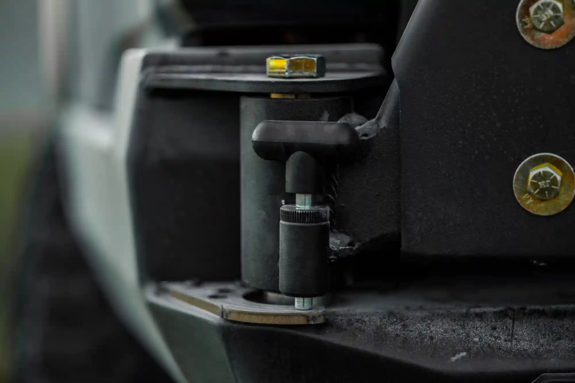 Close up of the latch pin on the Backwoods Adventure Mods 2016-2023 3rd Gen Toyota Tacoma Hi-Lite High Clearance Dual Swing Out Rear Bumper