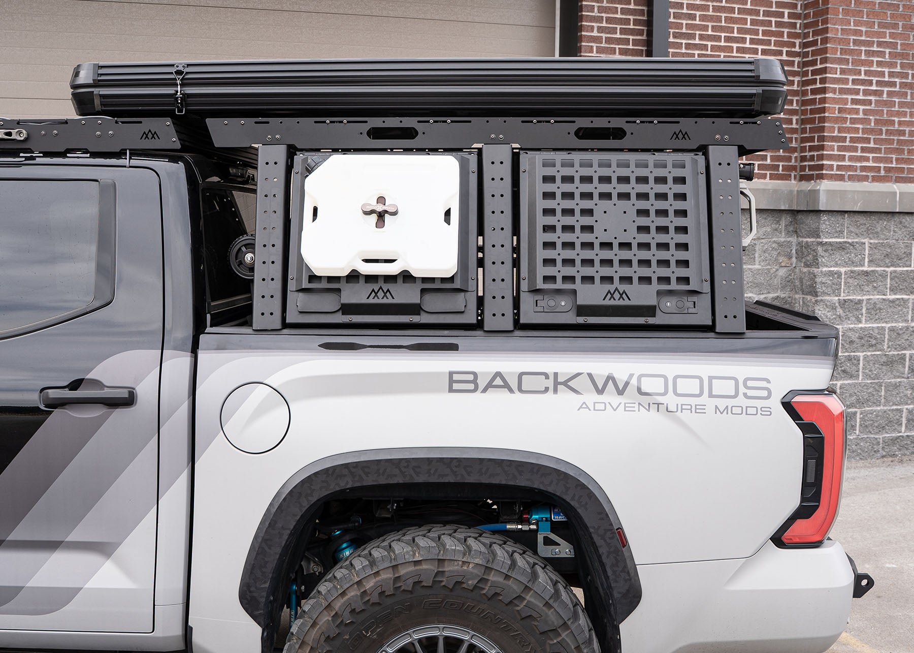 Backwoods Adventure Mods 3rd Gen Toyota Tundra Bed Rack installed with optional bed rack cargo storage boxes with locking lids closed