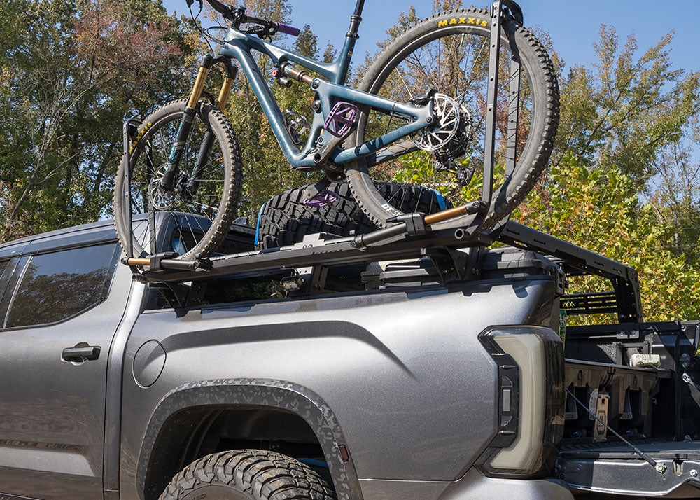 Backwoods Adventure Mods 3rd Gen Toyota Tundra Mid Height Bed Rack with bike tray mounting accessory installed