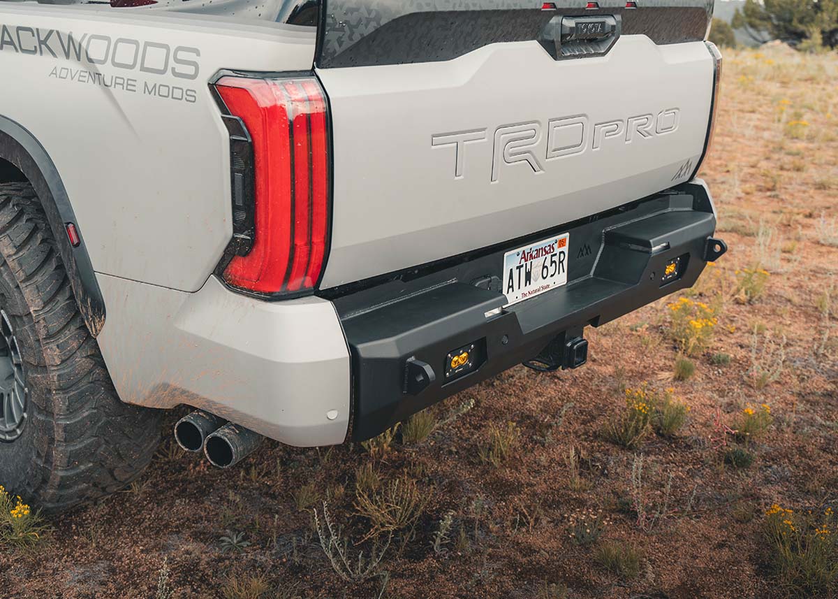 Image showing the recovery points, hitch, and surface light mounts on the Backwoods Adventure Mods 3rd Gen Toyota Tundra Rear Bumper