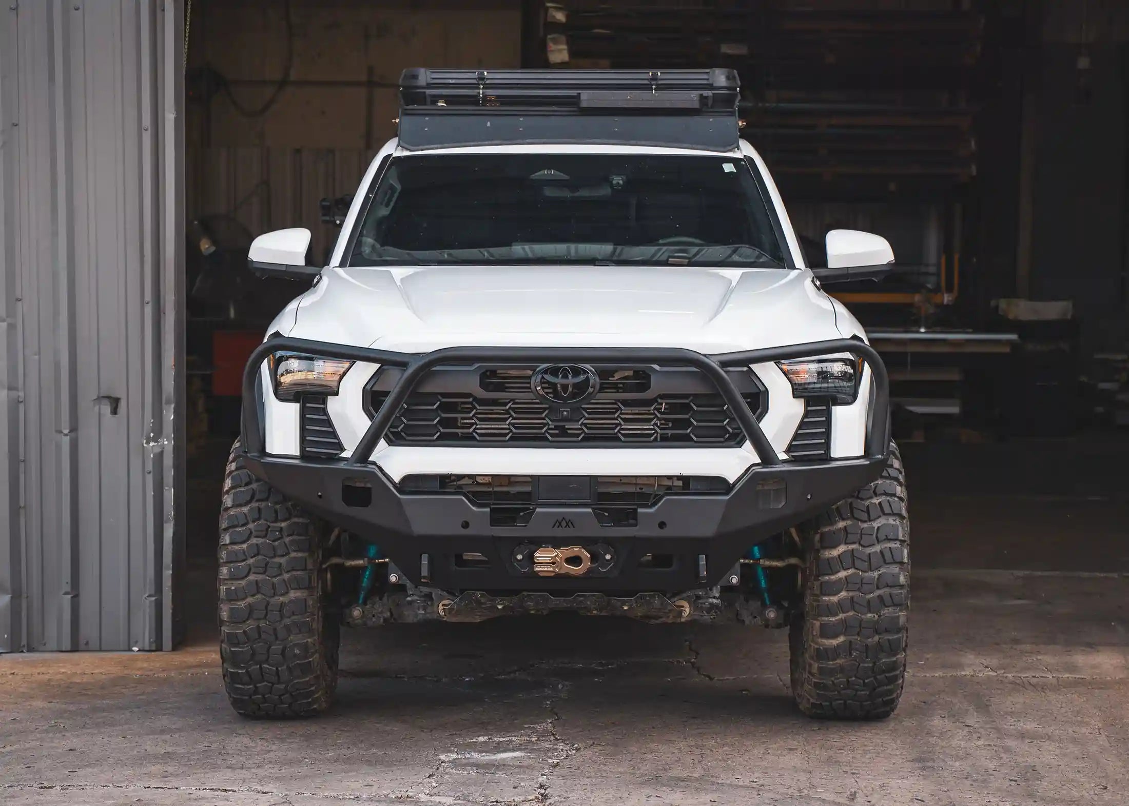 Backwoods Adventure Mods Hi-Lite Overland Front Bumper with Bull Bar installed on a 4th Gen 2024 Toyota Tacoma