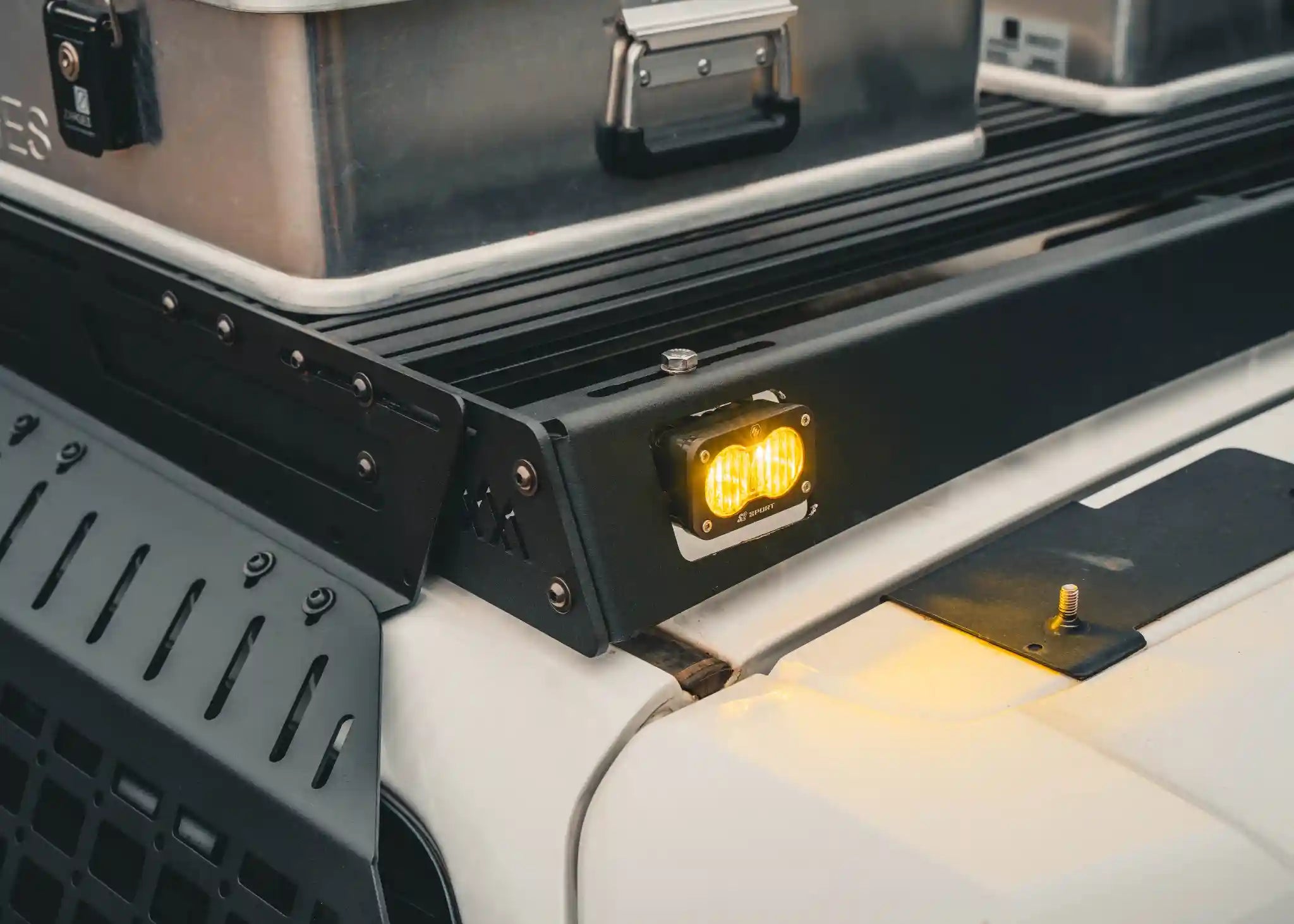 Close up of the off road chase light mount in the rear fairing of the Backwoods Adventure Mods Toyota 2010-2024 5th Gen 4Runner DRIFTR Roof Rack