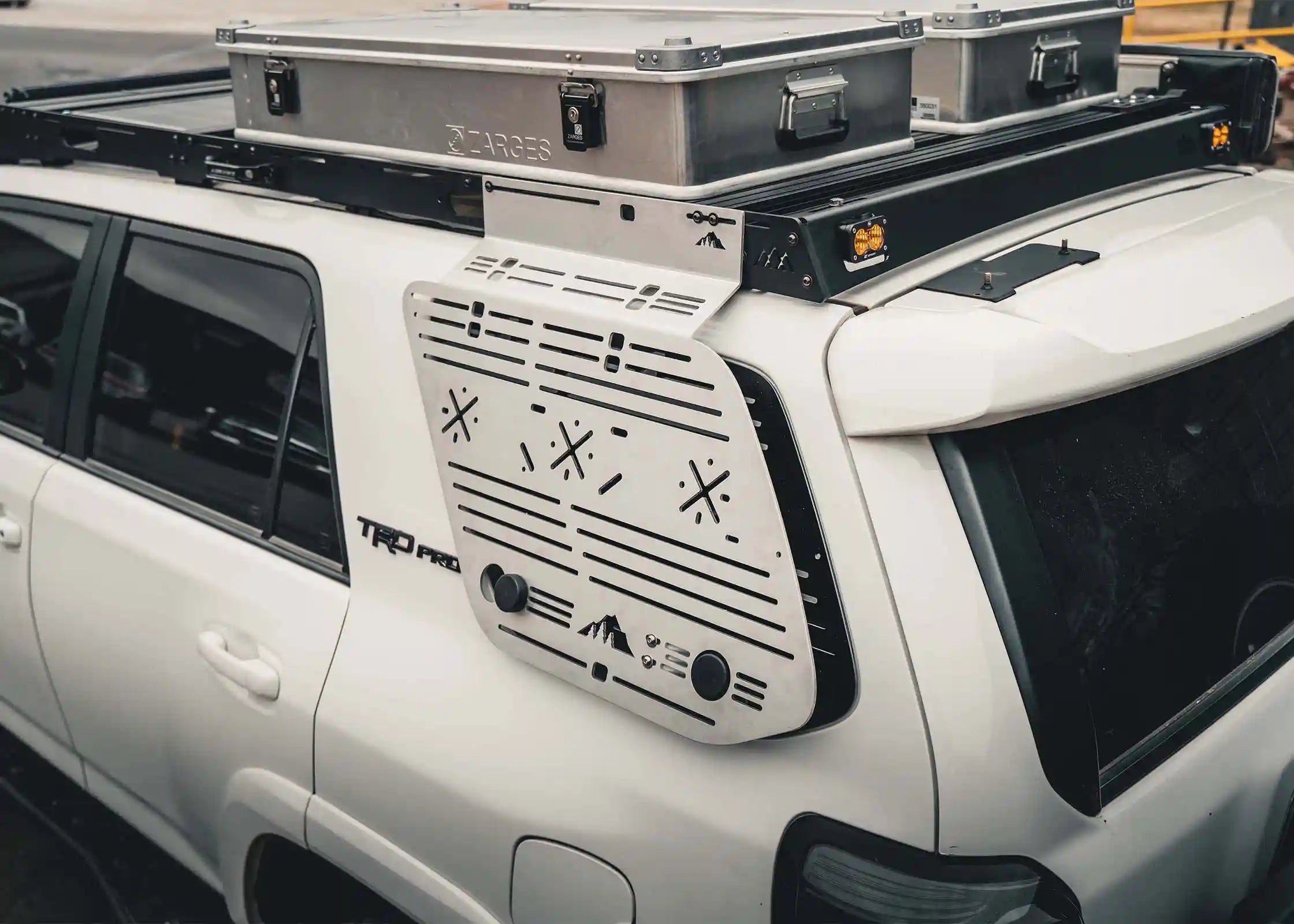 Image showing the side of the Backwoods Adventure Mods 2010-2024 5th Gen Toyota 4Runner DRIFTR Roof Rack with accessories mounted