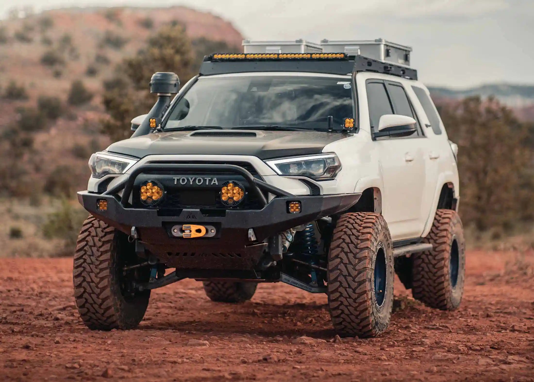 White 5th Gen Toyota 4runner with a Backwoods Adventure Mods Hi-Lite Overland Prerunner Bull Bar Front Bumper installed