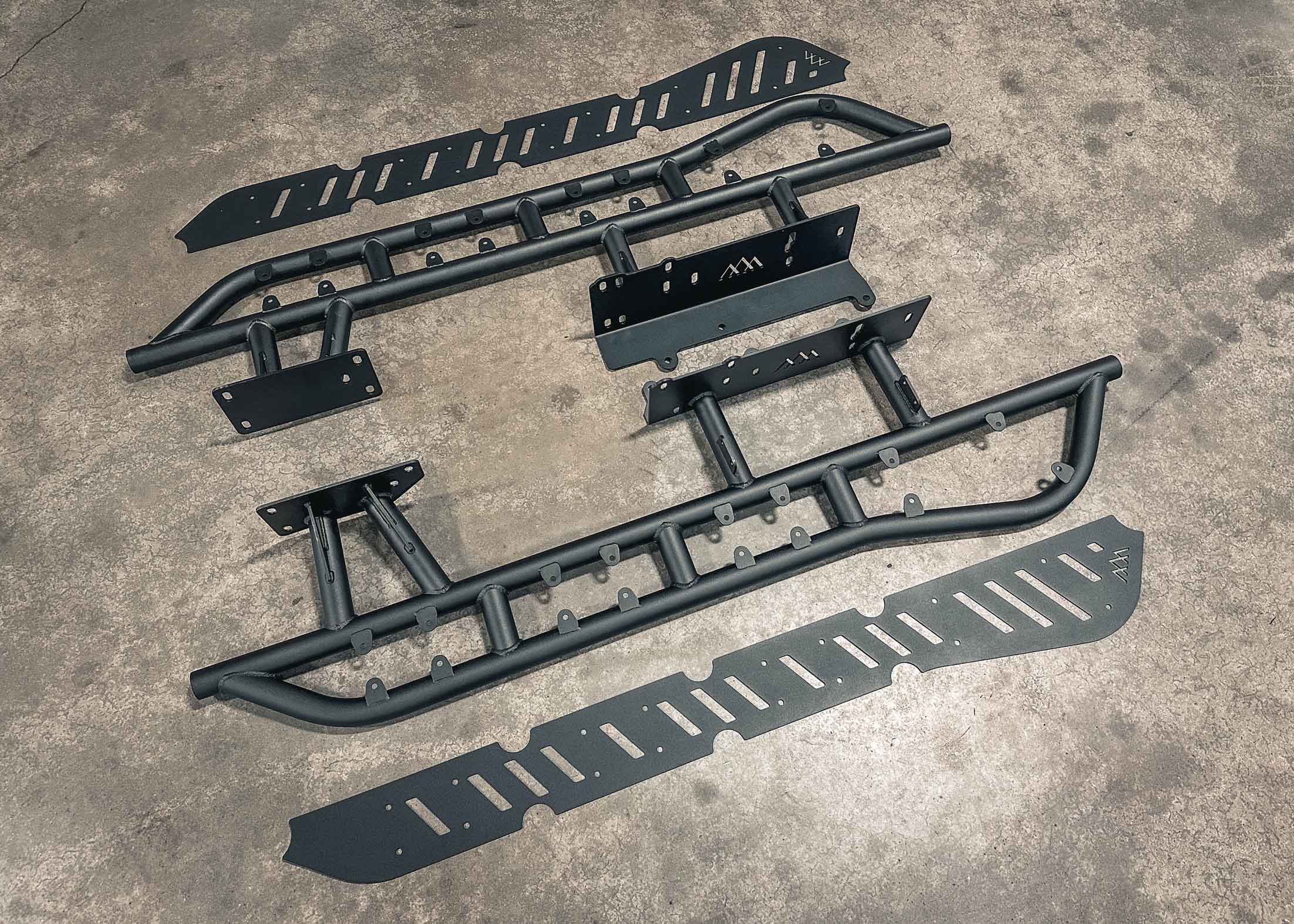 Installation components for the Backwoods Adventure Mods 2010-2024 5th Gen Toyota 4Runner Rock Sliders