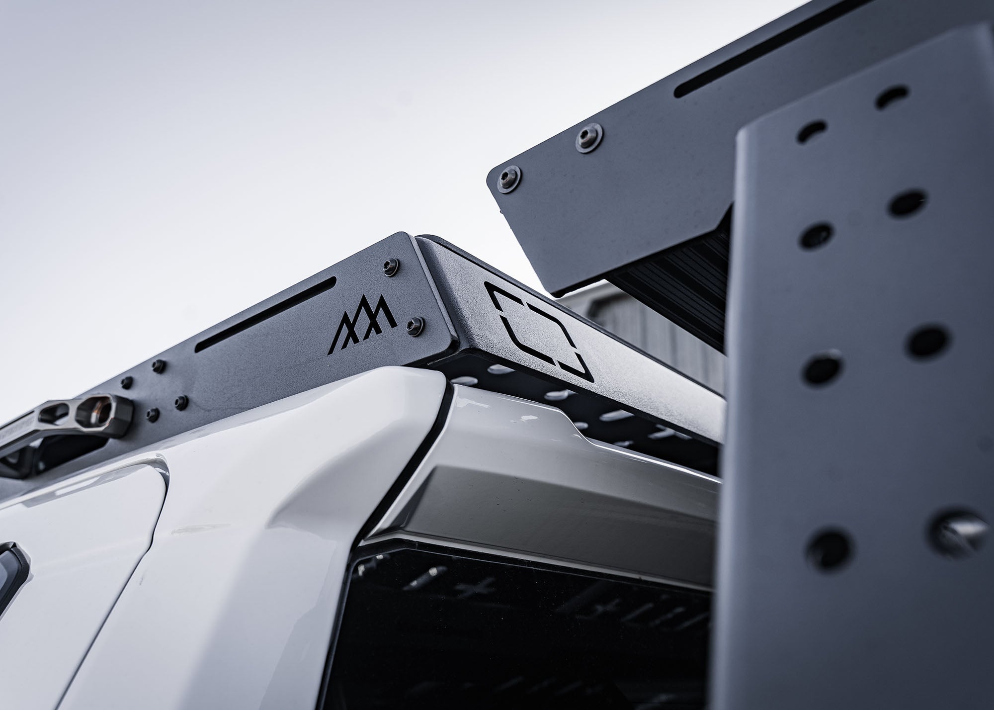 Close-up rear view of 2024 Tacoma Backwoods Adventure Mods DRIFTR roof rack