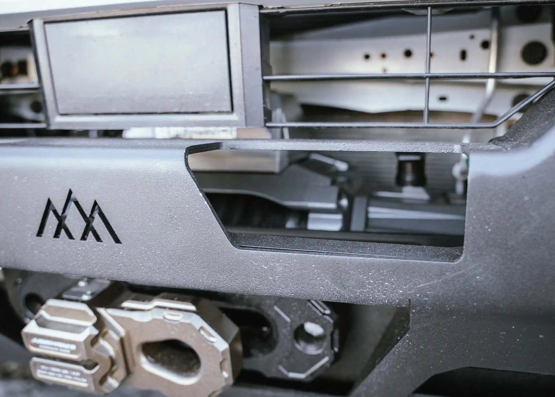 Close up of Backwoods Adventure Mods 2024 Toyota Tacoma 4th Gen Hi-Lite Overland aluminum Front Bumper installed for high clearance off road