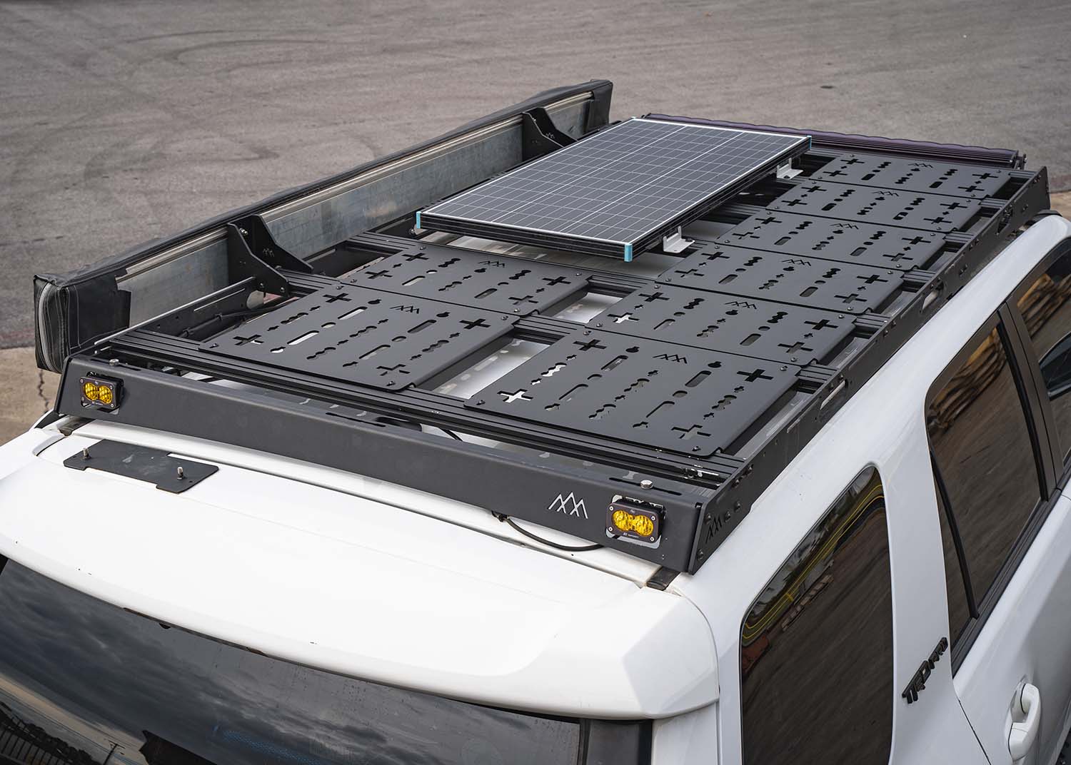 Awning installed on a Backwoods Adventure Mods DRIFTR Roof Rack using the HD heavy-duty Awning Brackets