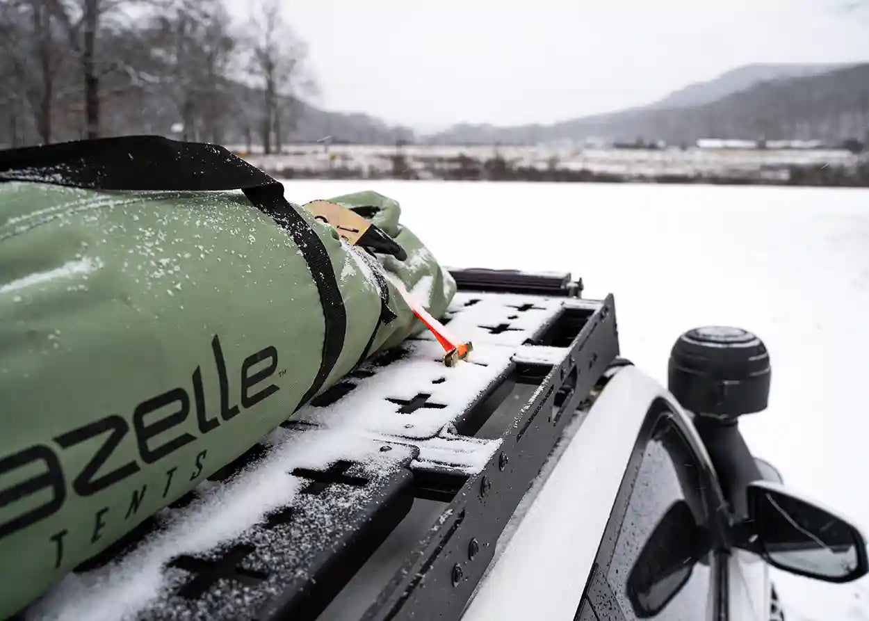 Backwoods Adventure Mods DRIFTR Roof Rack modular Deck Panel Accessory being used to secure cargo to the DRIFTR roof rack