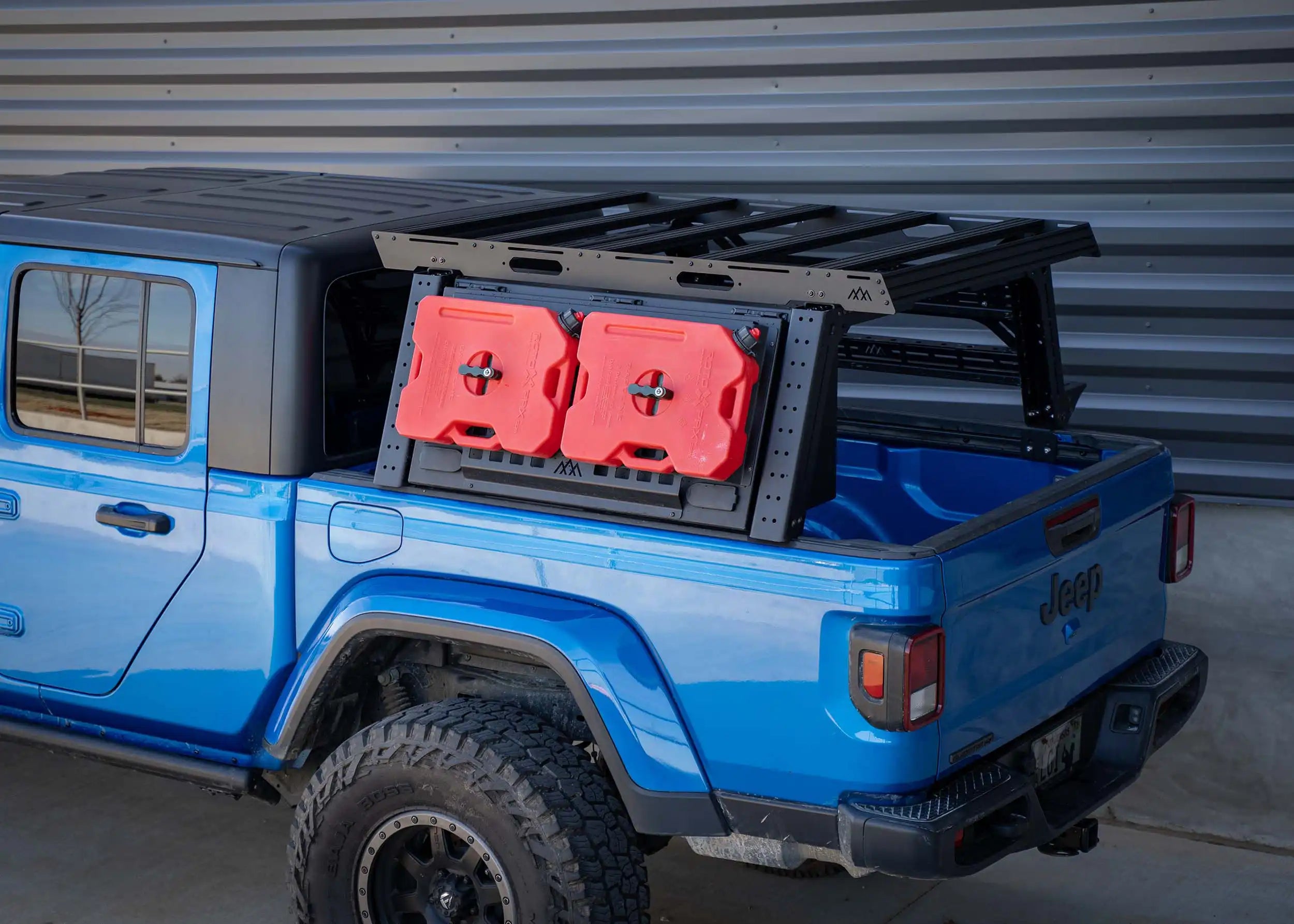Backwood Adventure Mods Jeep Gladiator Bed Rack installed on a blue Jeep Gladiator overland build