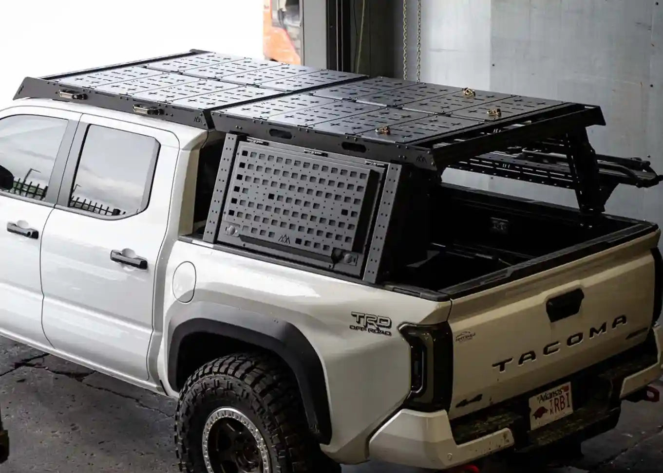 Toyota Tacoma Overland Bed Rack installed on a white 3rd gen Tacoma truck bed with other Backwoods Adventure Mods accessories