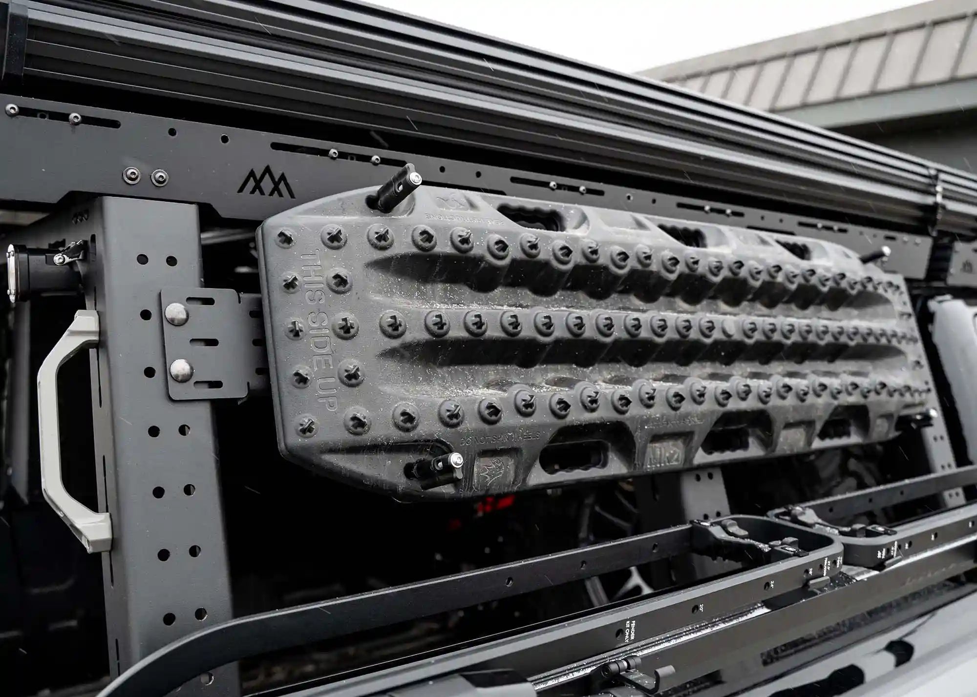 Backwoods Adventure Mods Dogbone Universal Traction Board Mount with off road recovery traction boards installed