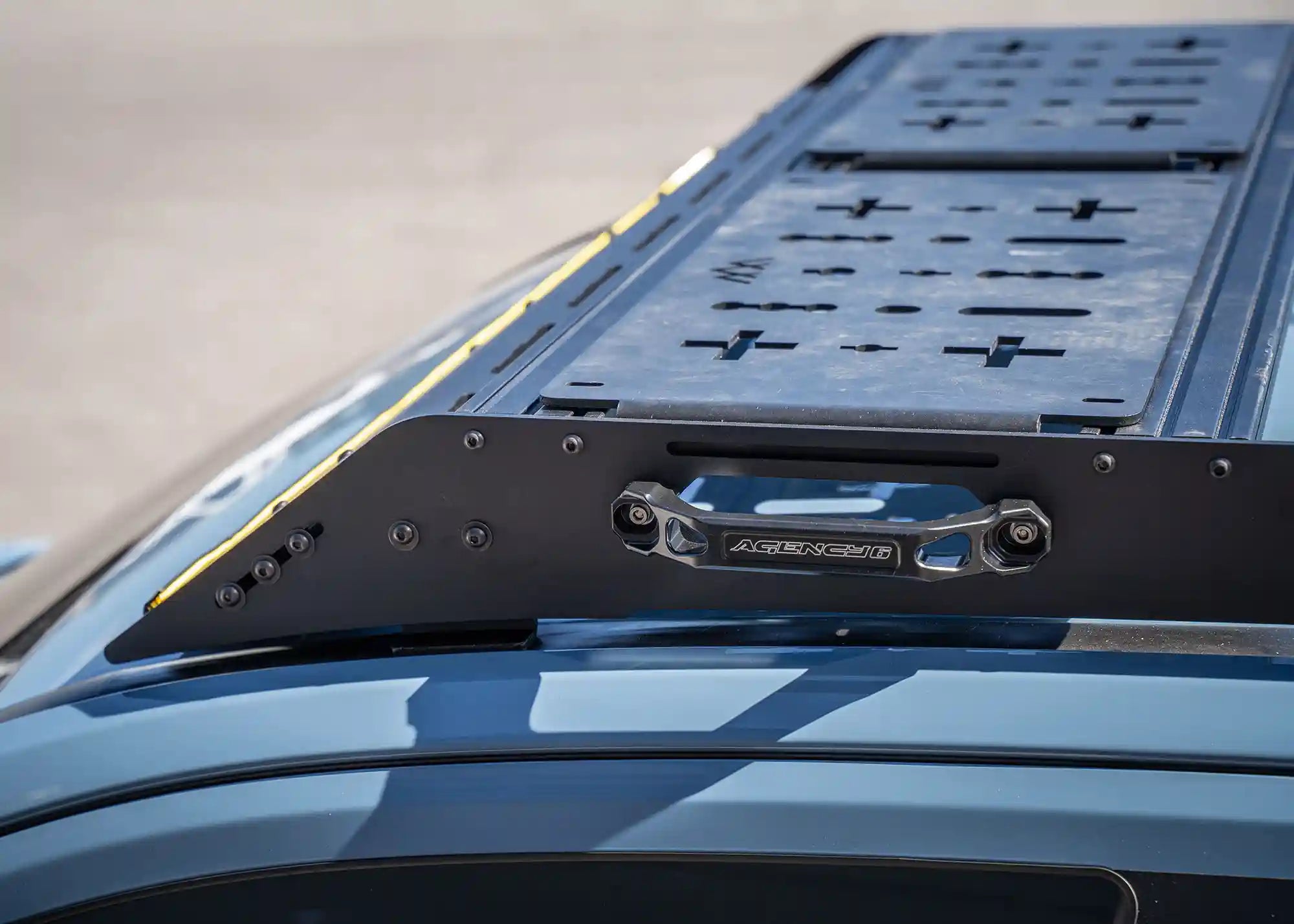 Close up of the DRIFTR 6th Gen 4Runner Roof Rack System installed with optional deck panel accessories mounted to the crossbars
