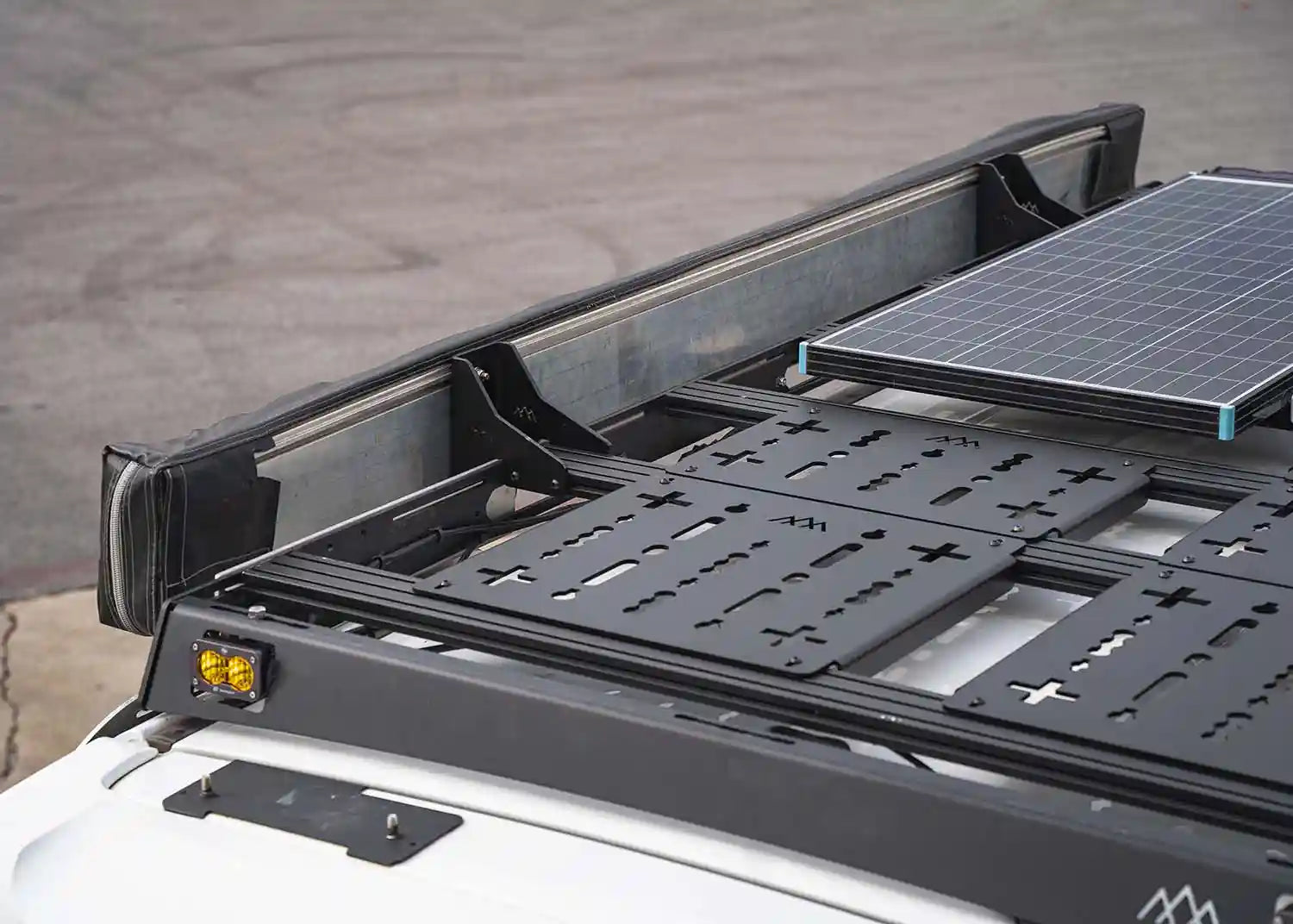 Awning installed on a Backwoods Adventure Mods DRIFTR Roof Rack using the HD heavy-duty Awning Brackets