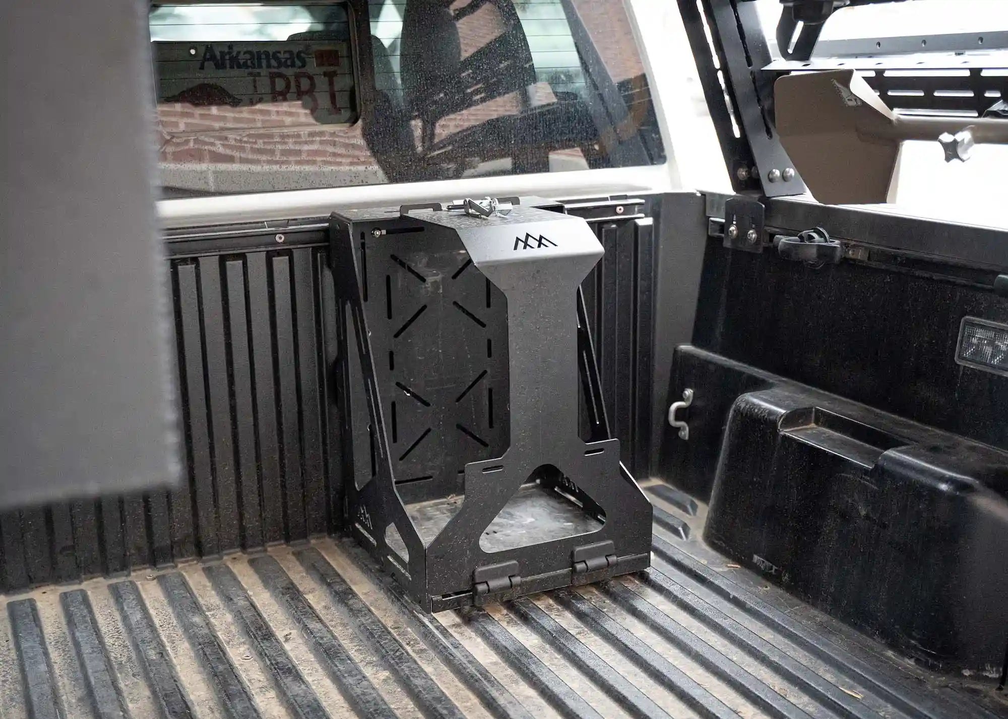 Backwoods Adventure Mods Jerry Can Holder Mount installed in a pickup truck bed