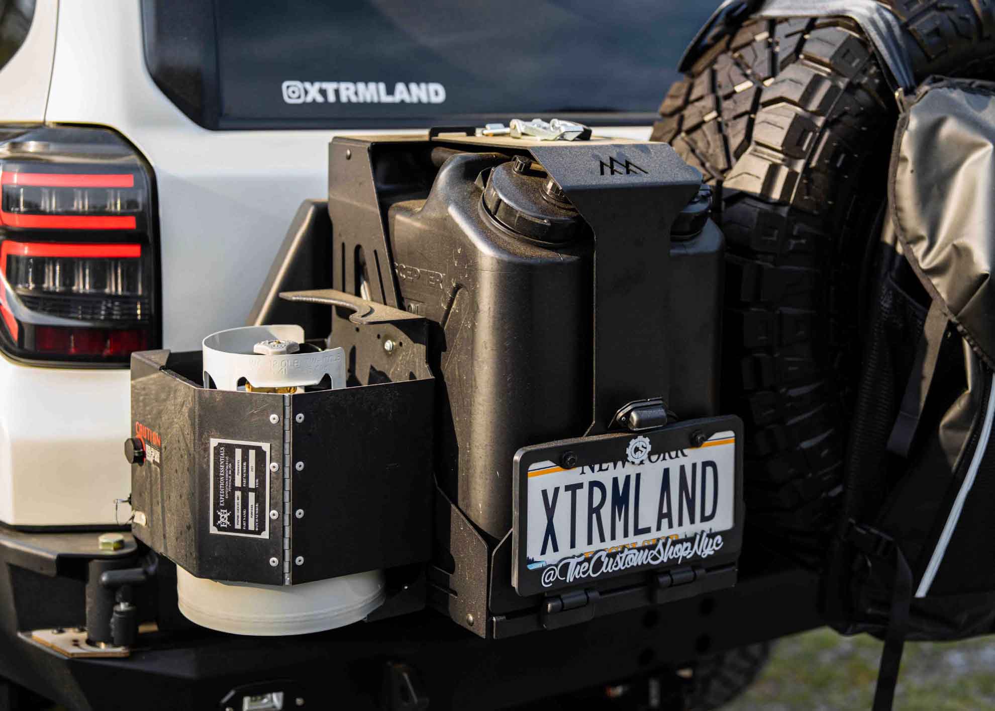 Backwoods Adventure Mods Jerry Can Holder Mount with a propane tank mounted to the side
