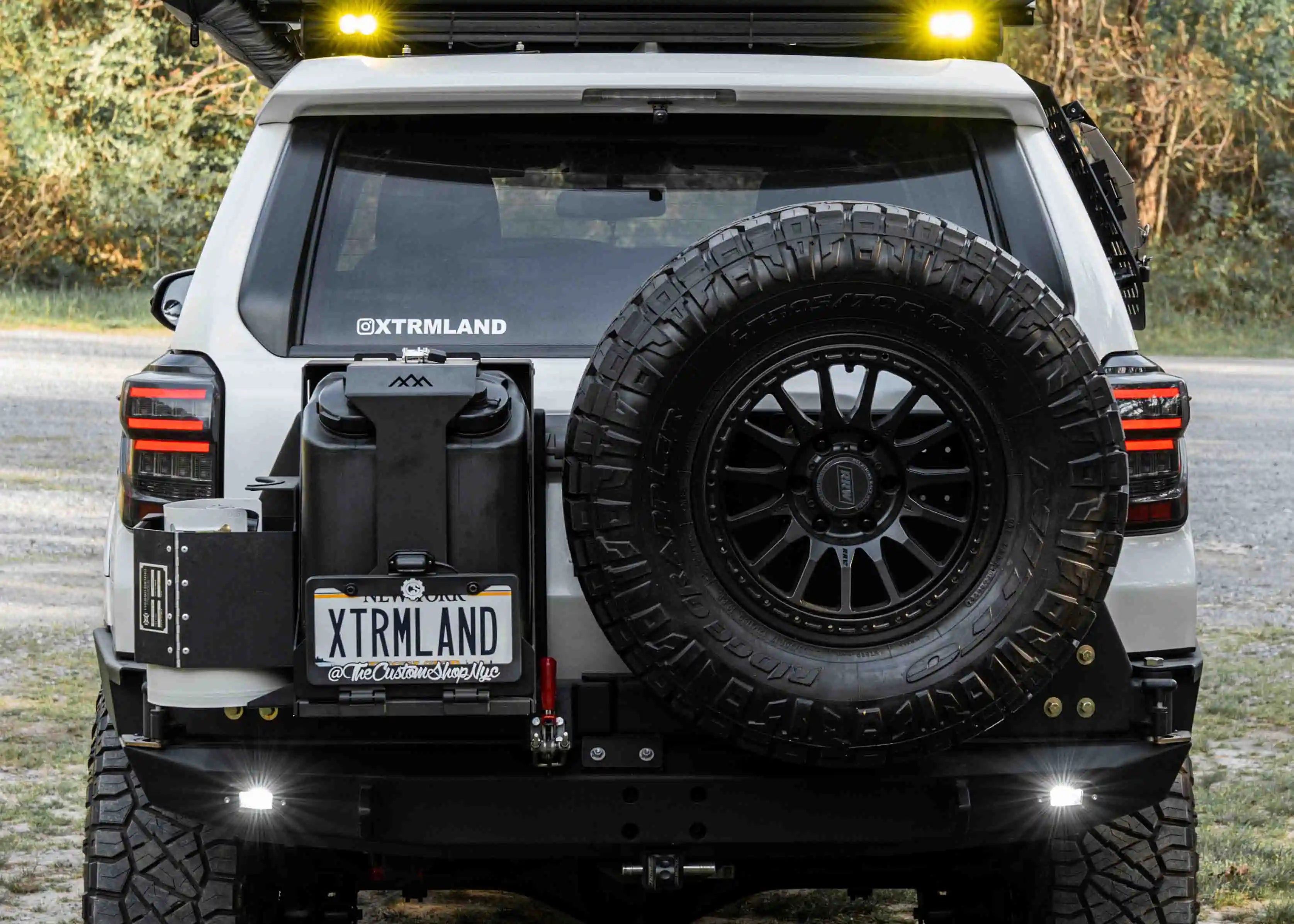 Backwoods Adventure Mods Jerry Can Mount Holder with a propane tank and fuel cans mounted