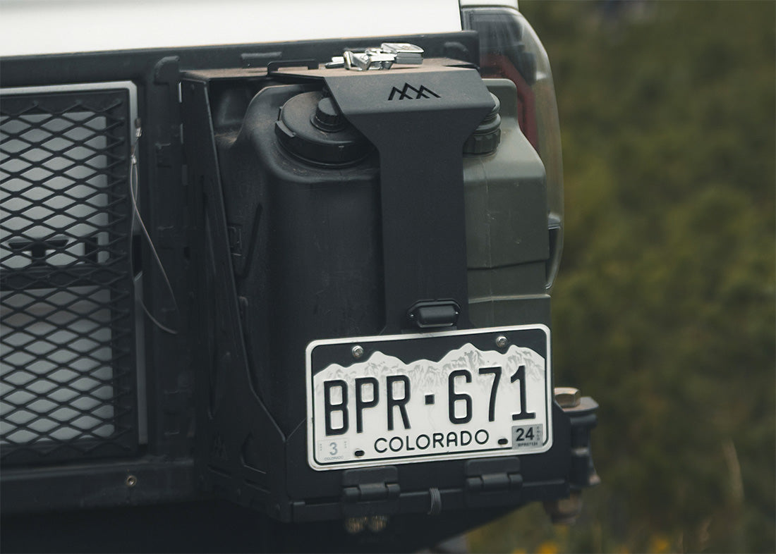 Image of a Backwoods Adventure Mods Dual Jerry Can Holder Mount installed