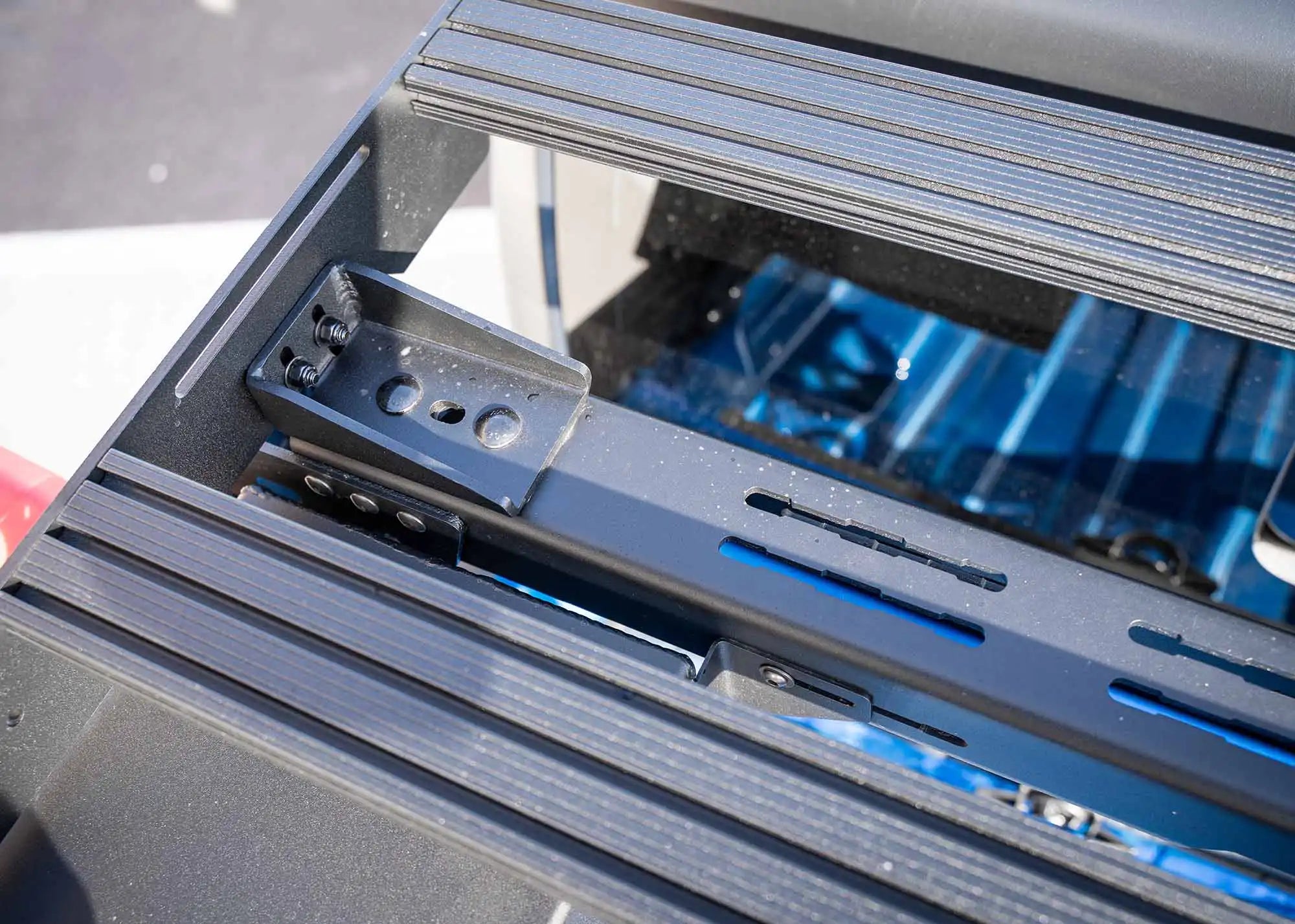 Close up image of the hardware used to mount the DRIFTR Topper to the Backwoods Adventure Mods Jeep Gladiator Bed Rack