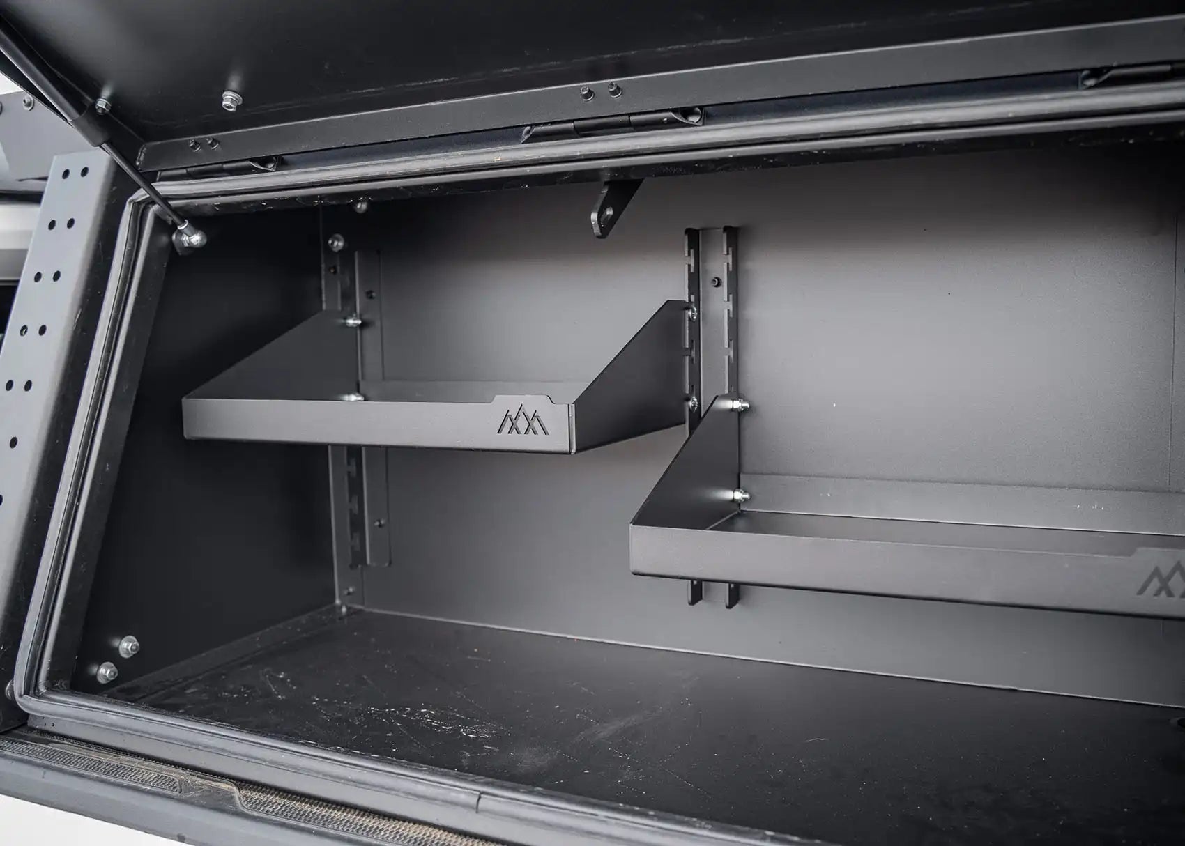 Close up of the adjustable shelving in the Backwoods Adventuer Mods Jeep Gladiator Bed Rack Storage Box