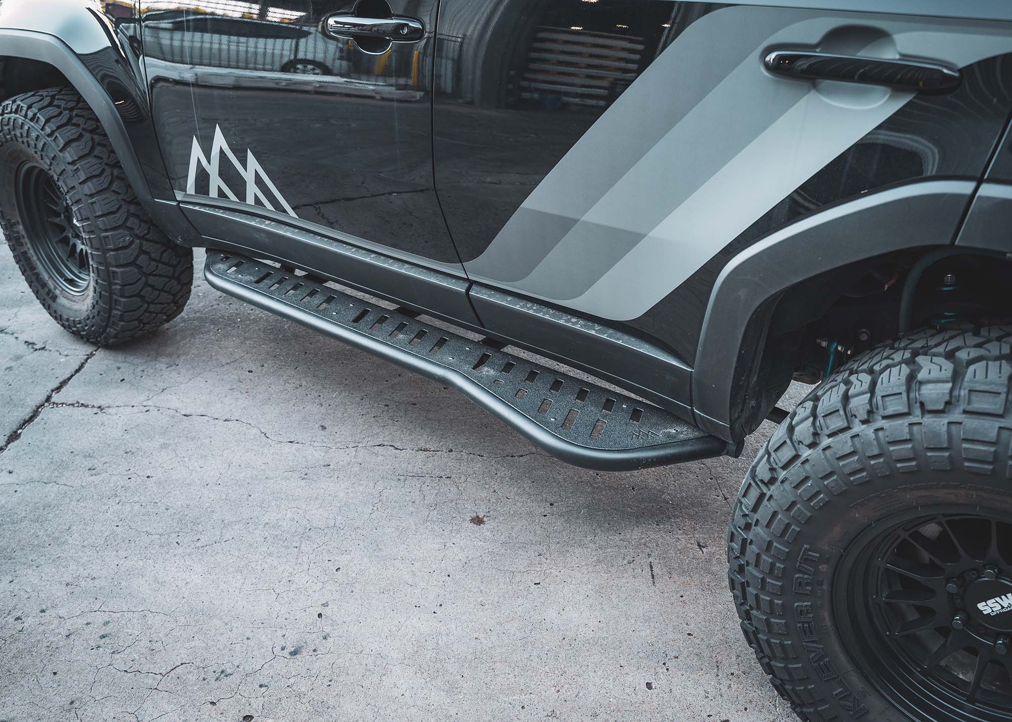 Landcruiser 250 equipped with LC250 Rock Sliders from Backwoods Adventure Mods