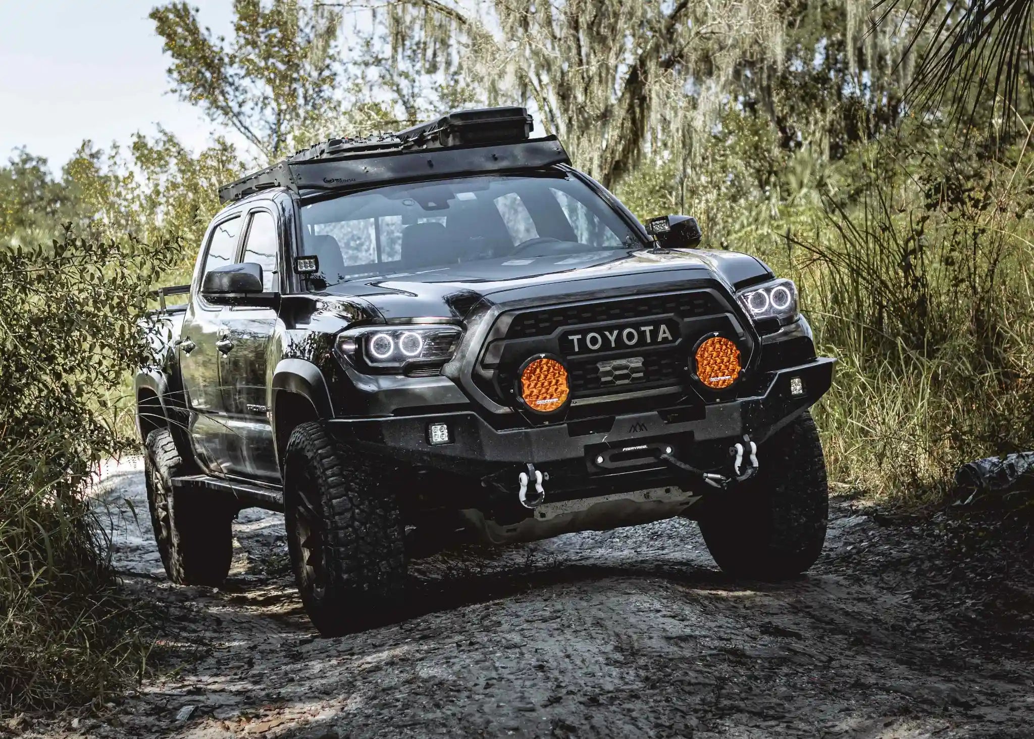 Pathfinder PROWLR 9 inch LED off road amber Driving Lights installed on a 3rd gen tacoma with a Backwoods Adventure Mods Hi-Lite series hybrid off road bumper