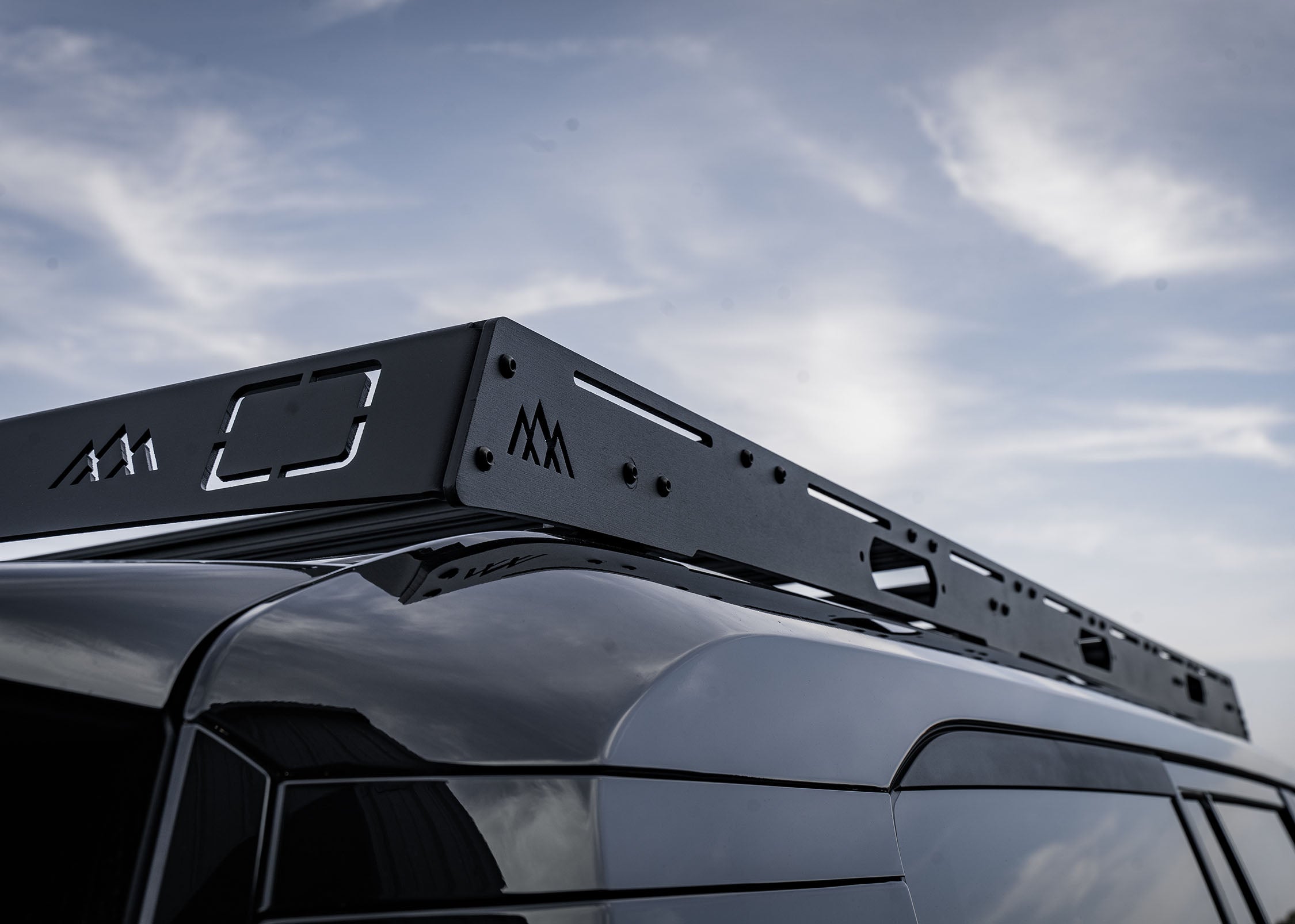 Backwoods Adventure Mods DRIFTR roof rack installed on a black 250 series Toyota Land Cruiser