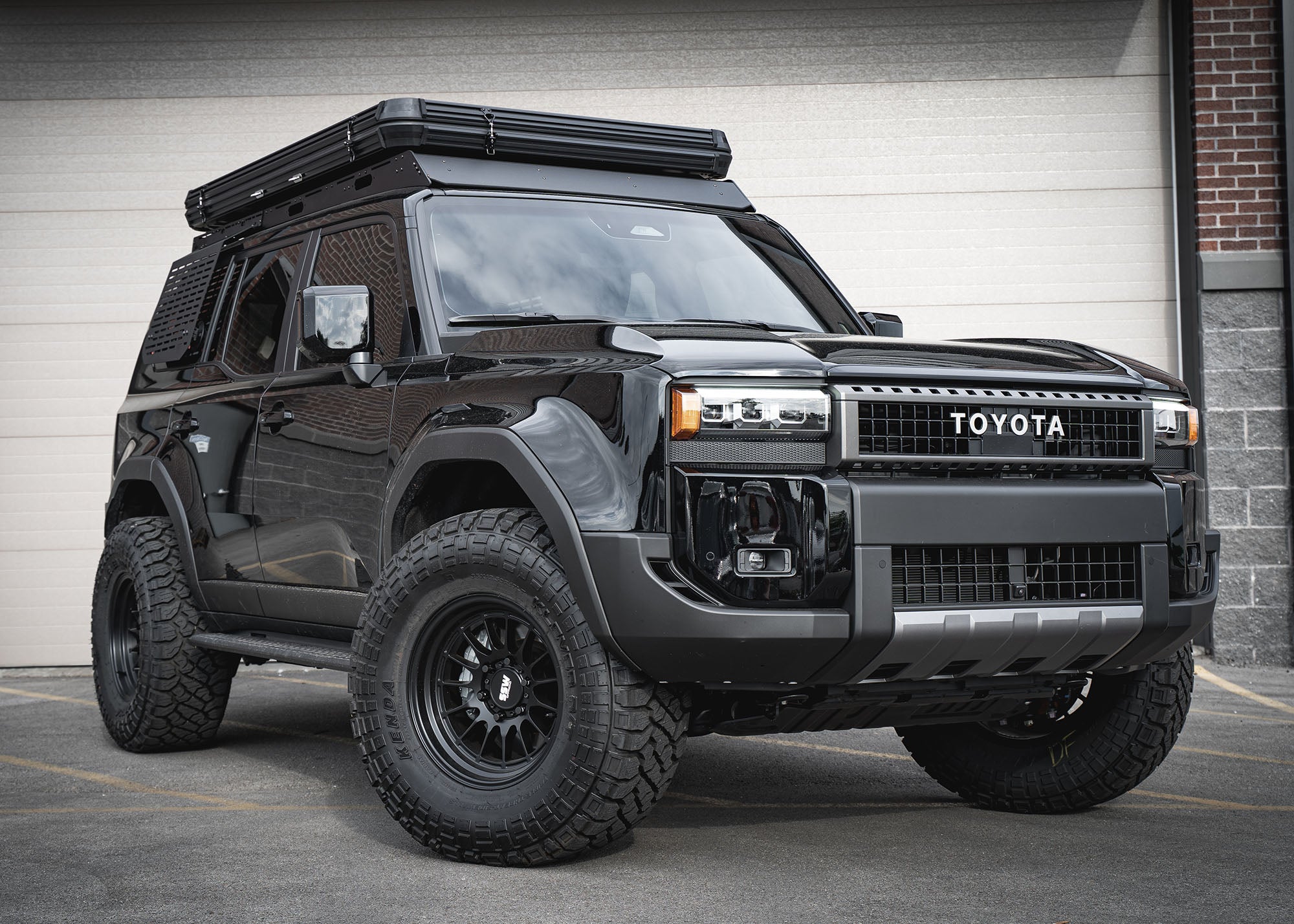Black Toyota Land Cruiser with a Backwoods Adventure Mods DRIFTR roof rack installed