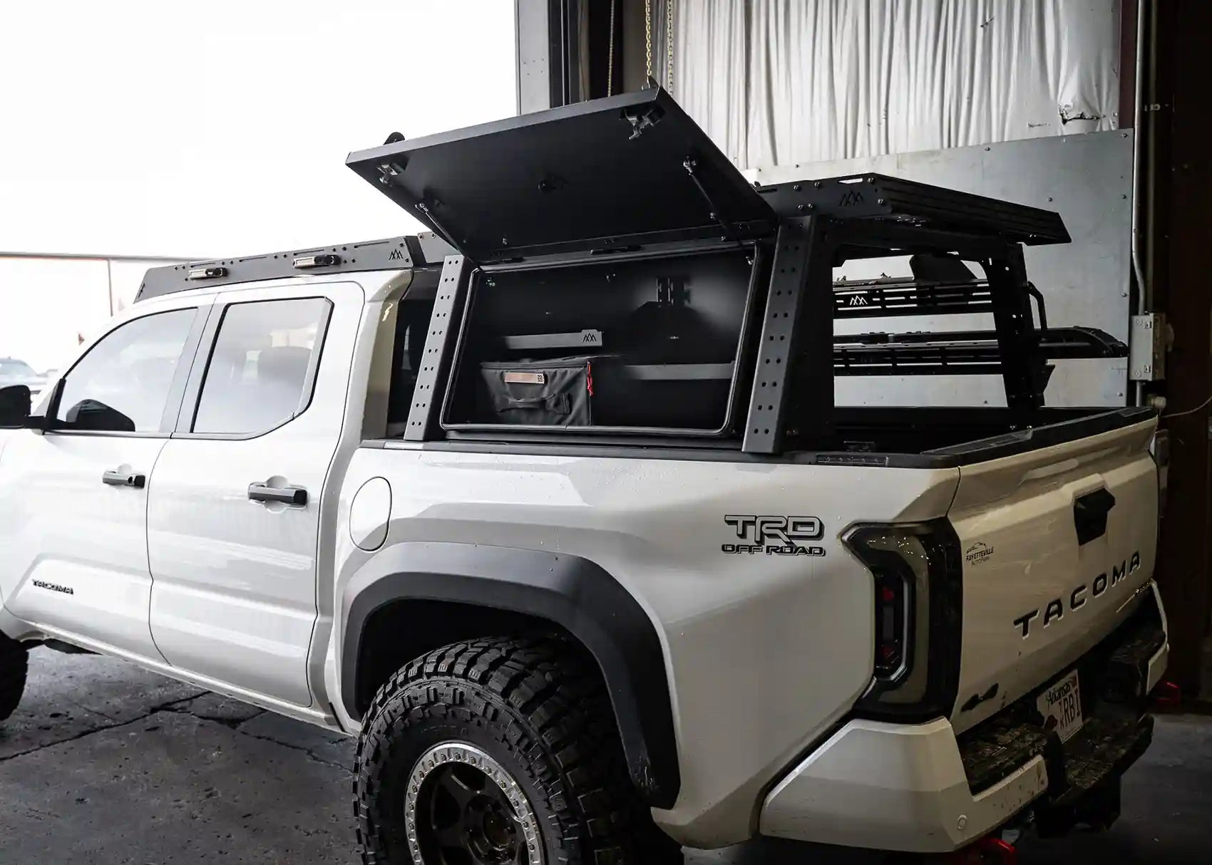 Backwoods Adventure Mods Toyota Tacoma bed rack storage box with gas strut lid lifts