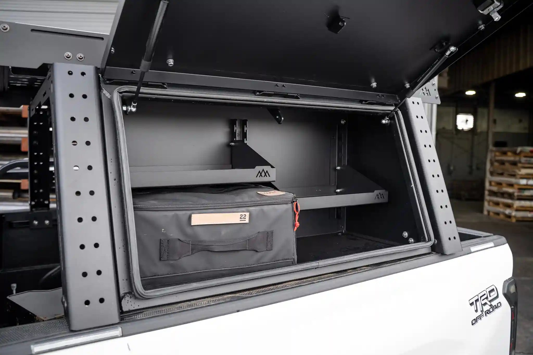 Interior of the Backwoods Adventure Mods Toyota Tacoma bed rack storage box