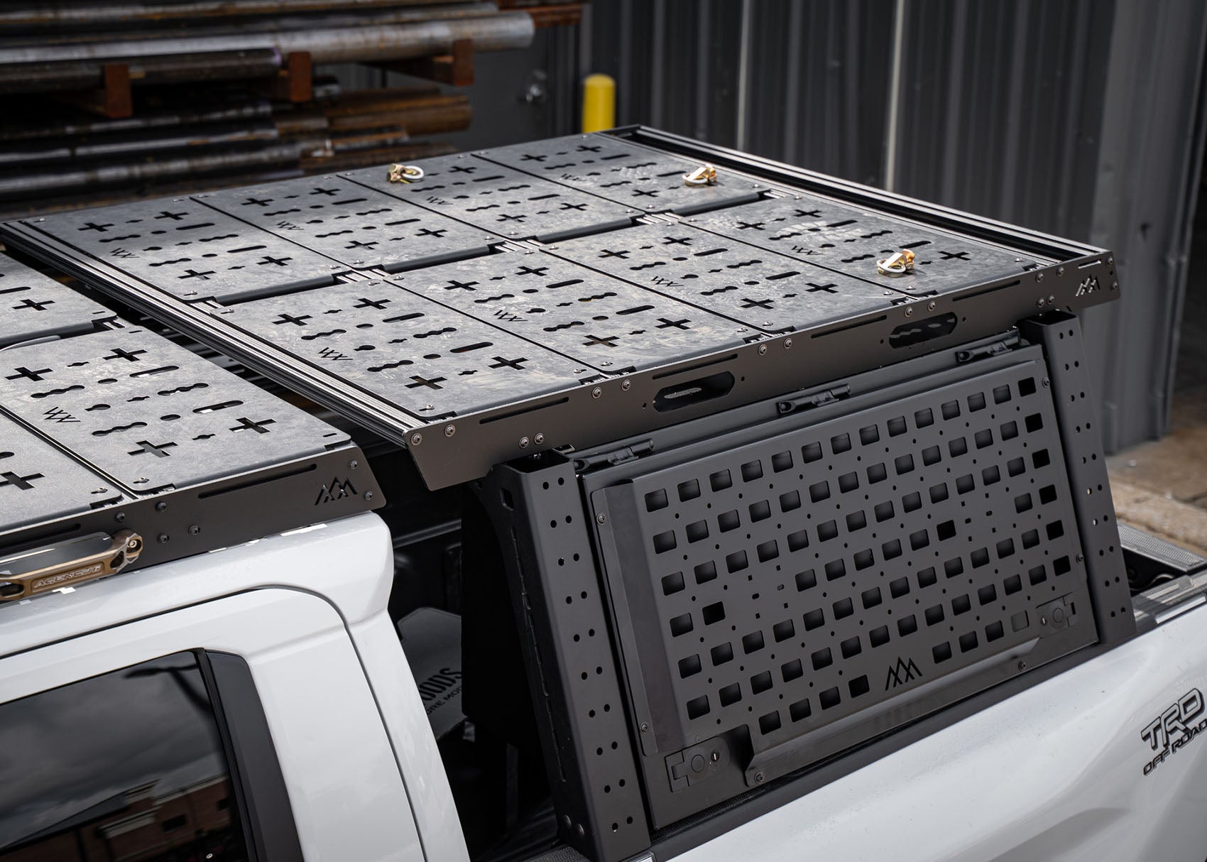 Backwoods Adventure Mods Bed Rack DRIFTR Topper cargo carrier add-on installed on a 3rd Gen Toyota Tacoma Overland truck bed rack with accessories