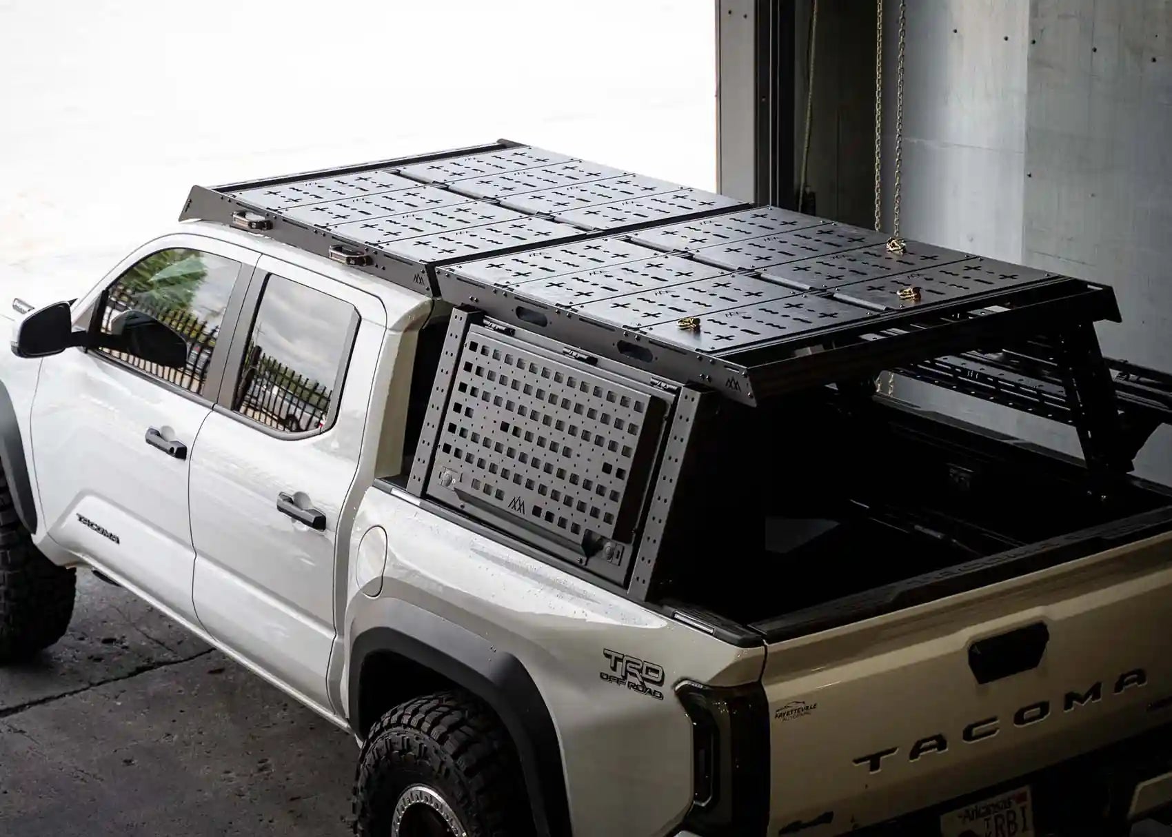 Backwoods Adventure Mods Bed Rack DRIFTR Topper cargo carrier add-on installed on a 3rd Gen Toyota Tacoma Overland truck bed rack with optional storage accessories