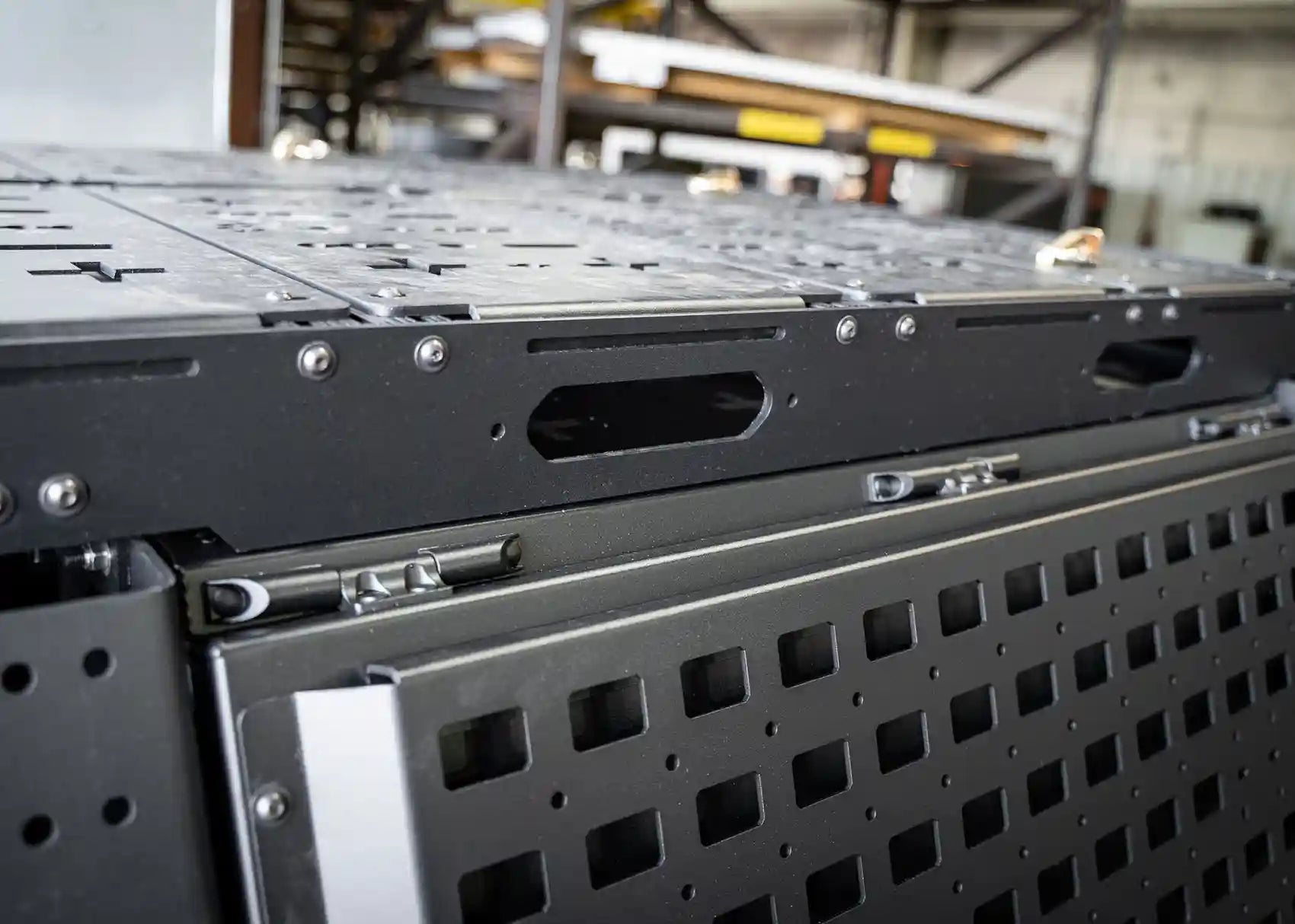 Side image of the Backwoods Adventure Mods Bed Rack DRIFTR Topper cargo carrier add-on for 2005+ Toyota Tacoma truck bed rack