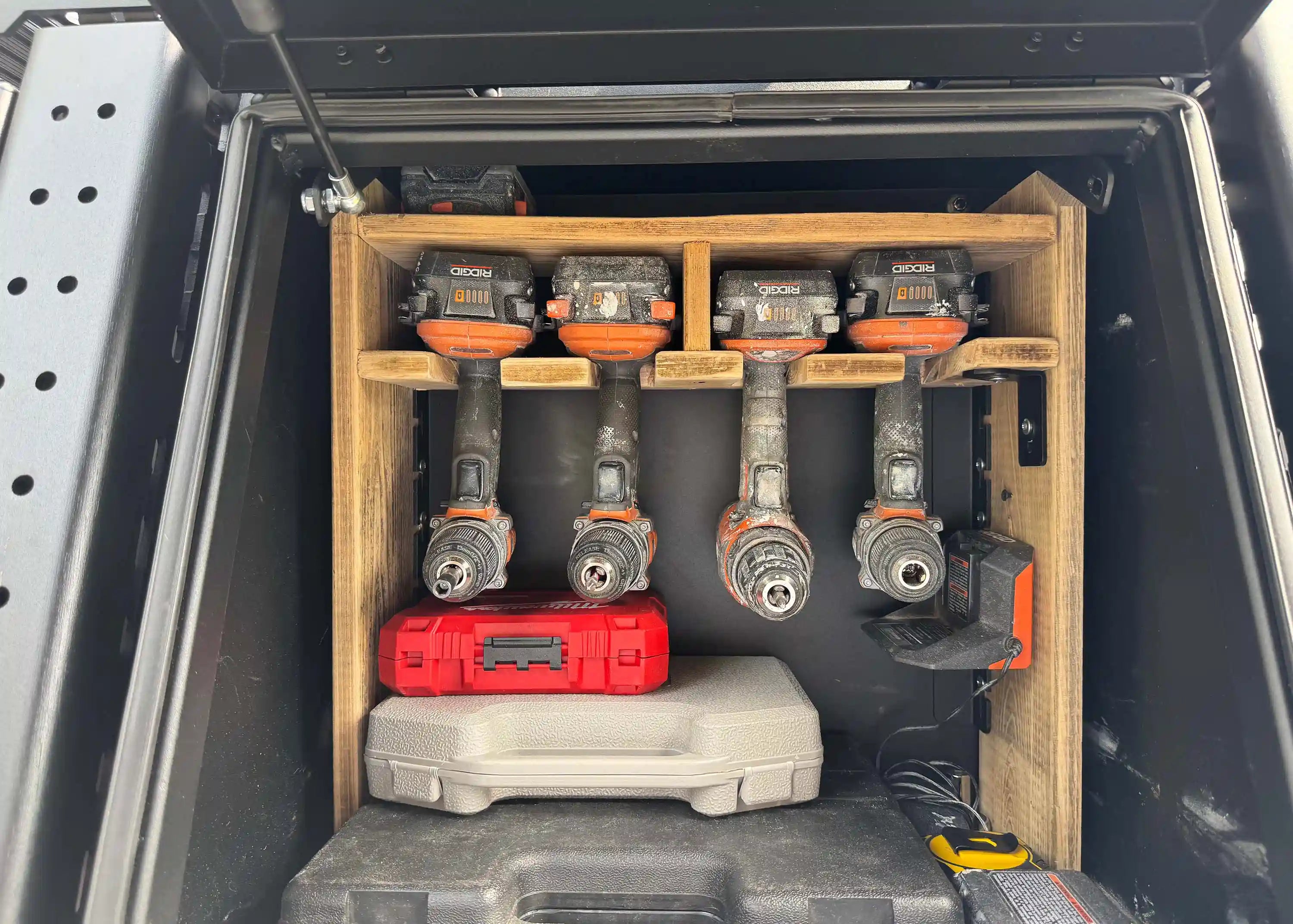 Power tools organized and stored securely inside the locking Backwoods Adventure Mods Toyota Tundra Aluminum Bed Rack Storage Box