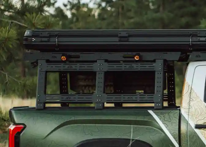 3rd Gen Toyota Tundra driving off road with a Backwoods Adventure Mods Truck Bed Rack System Starter Bundle installed