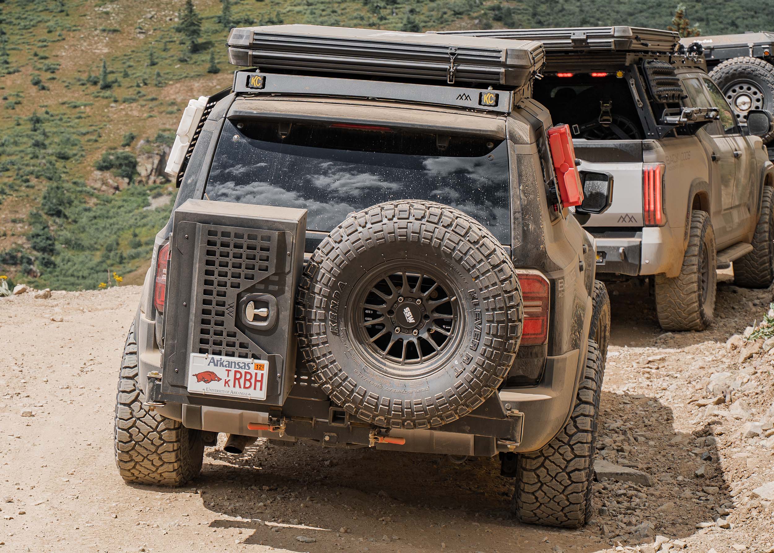 Backwoods Adventure Mods Universal Overland Gear Storage Cargo Box attached to a Toyota Lancruiser while driving off road