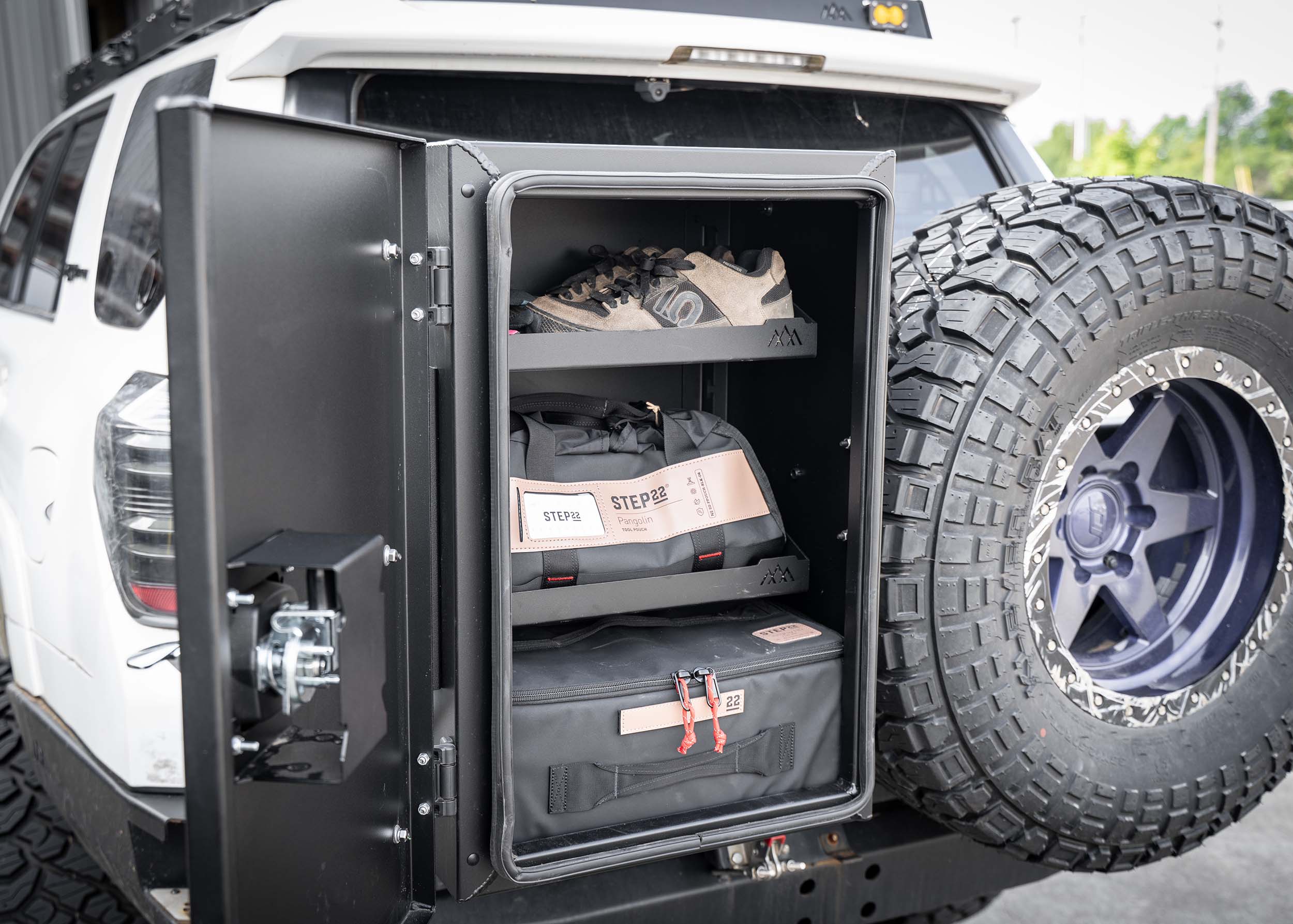 Installed Backwoods Adventure Mods Universal off-road vehicle overland storage cargo box open showing interior gear shelving organizer
