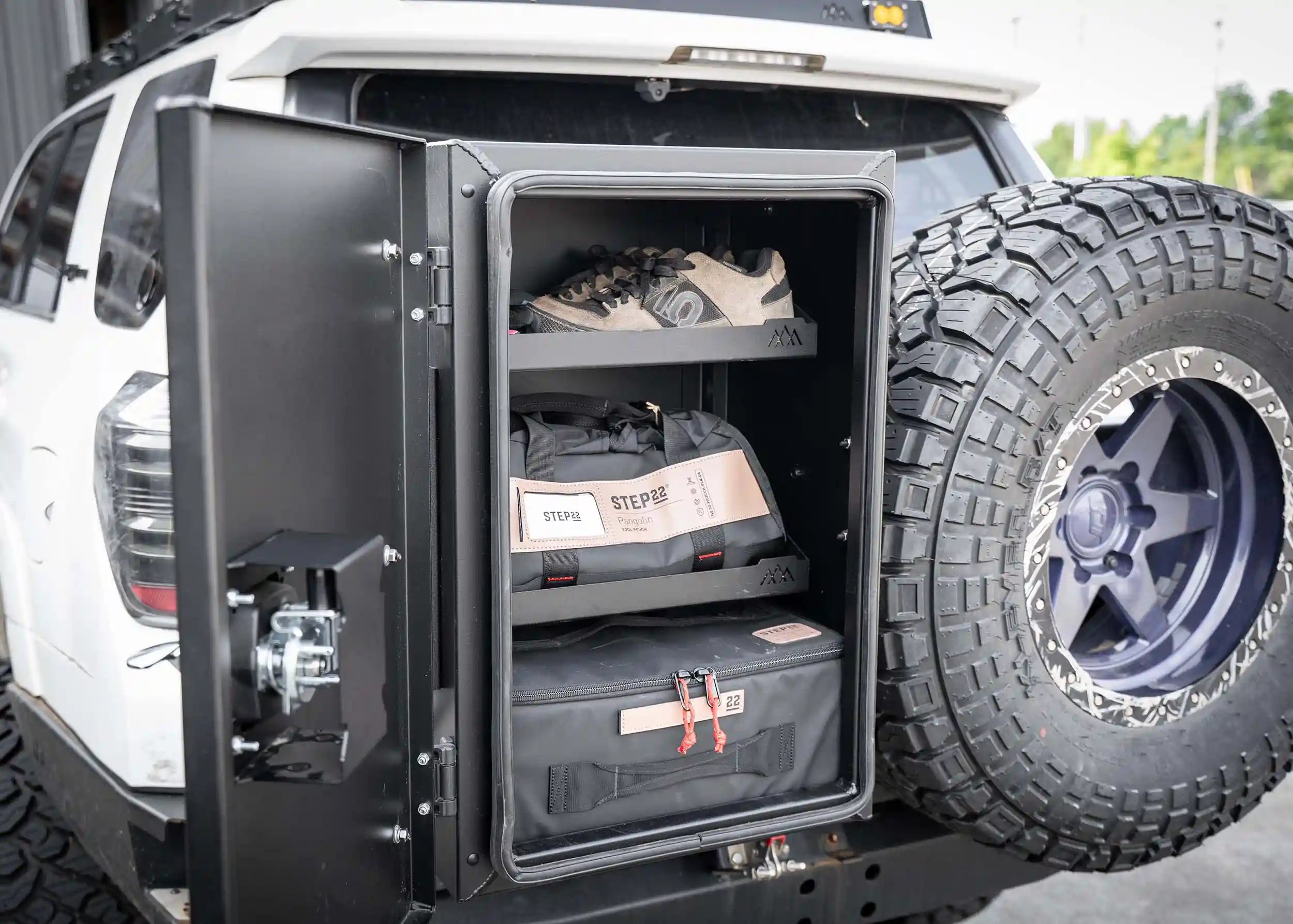 Installed Backwoods Adventure Mods Universal off-road vehicle overland storage cargo box open showing interior gear shelving organizer