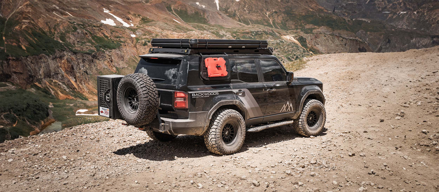 A land cruiser 250 on an offroad trail in colorado with accessories from Backwoods Adventure Mods