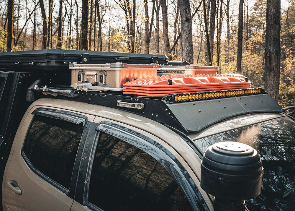 Backwoods Adventure Mods 2005-2023 2nd and 3rd Gen Toyota Tacoma DRIFTR Roof Rack being used to store off road recovery gear while overlanding